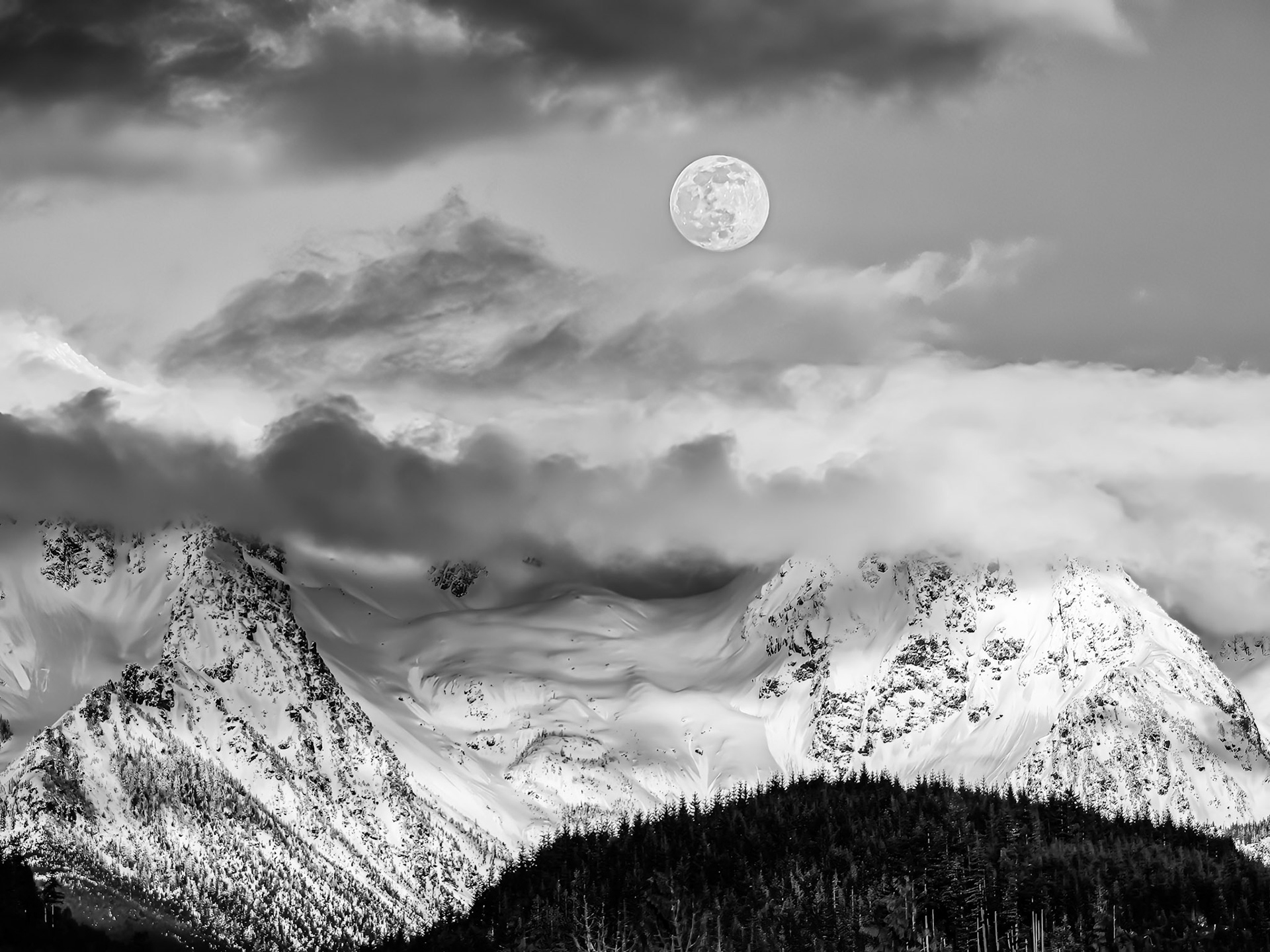 Twin Peaks Moonrise 1: The clouds parted on an overcast day to reveal the moon rising above Twin Peaks near Mt. Baker in the Washington Cascades