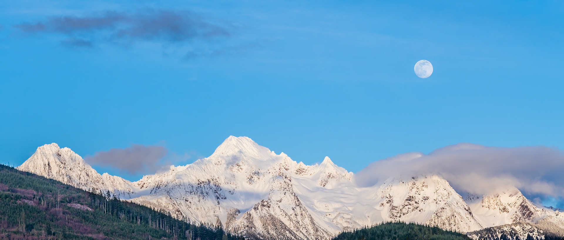 Twin Peaks Moonrise Panorama 4: The clouds parted on an overcast day to reveal the moon rising above Twin Peaks near Mt. Baker in the Washington Cascades