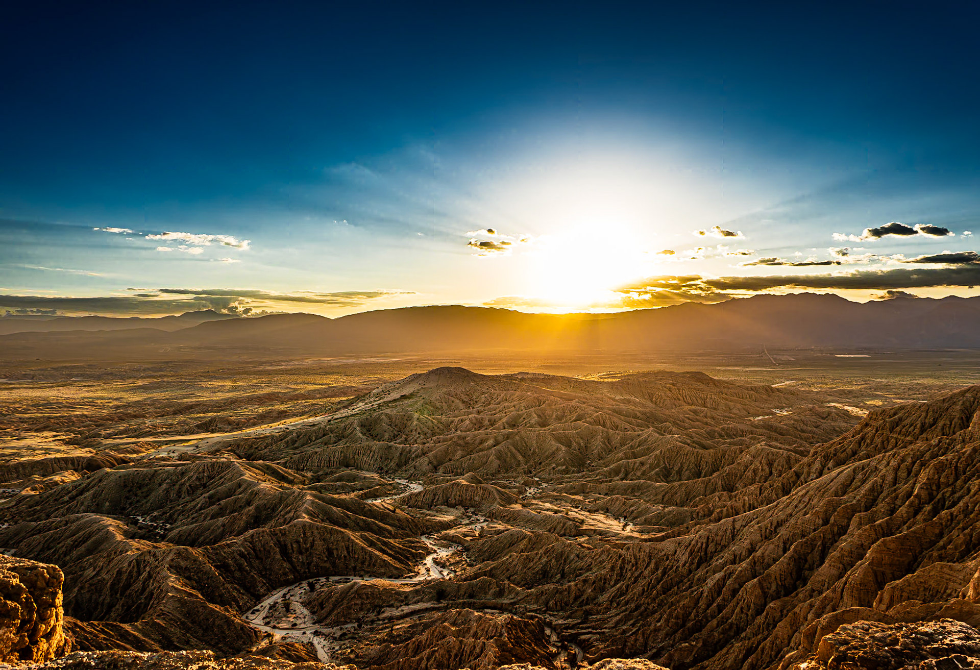 Borrego Sunset and Badlands: Sunset over the San Ysidro Mountains with the Borrego Valley and Badlands in the foreground. viewed from Font's Point in the Anza-Borrego Desert.