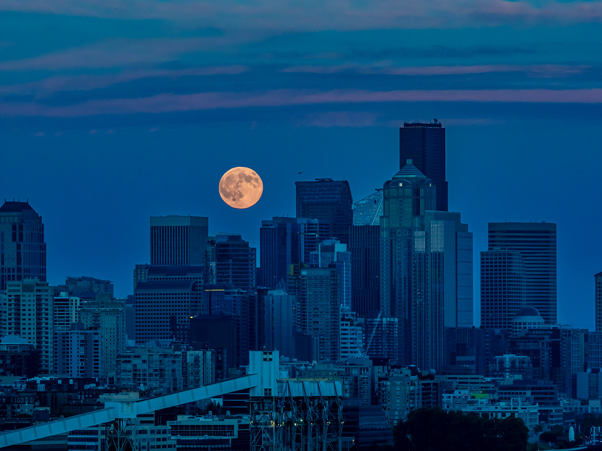 "Thunder" Moon Rising Over Seattle: A helicopter greets this mid-summer moon rising over the Seattle skyline.