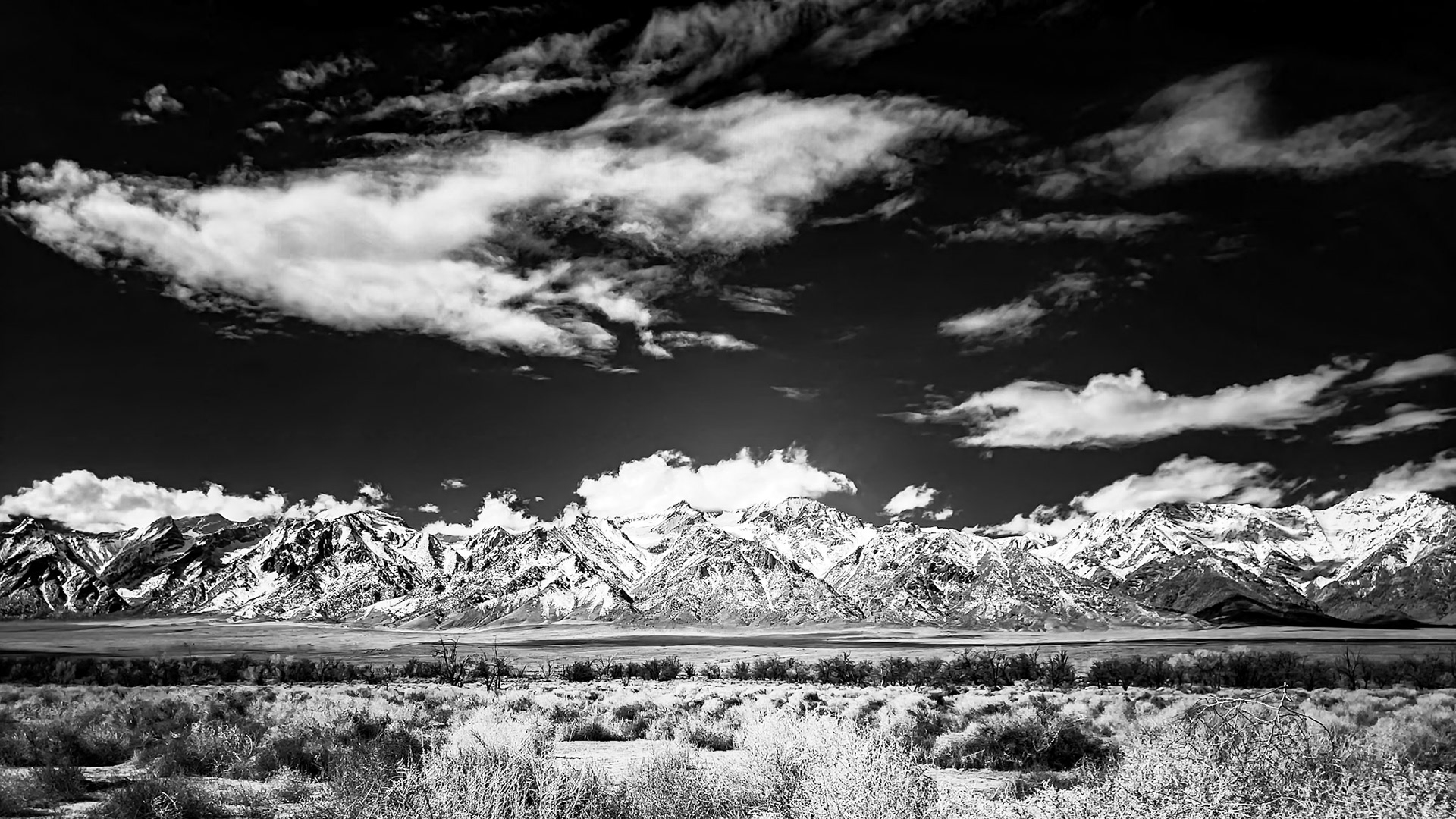 Owens Valley and the Sierrra Nevada Black-and-White: The magnifgicent Sierra Nevada Mountains viewed across the Owens Valley from the Manzanar National Historic site (formerly a WWII era  Internment Camp).  The Owens Valley is high desert sitting at about 4,000-ft and receiving less than 5 inches of rain per year.