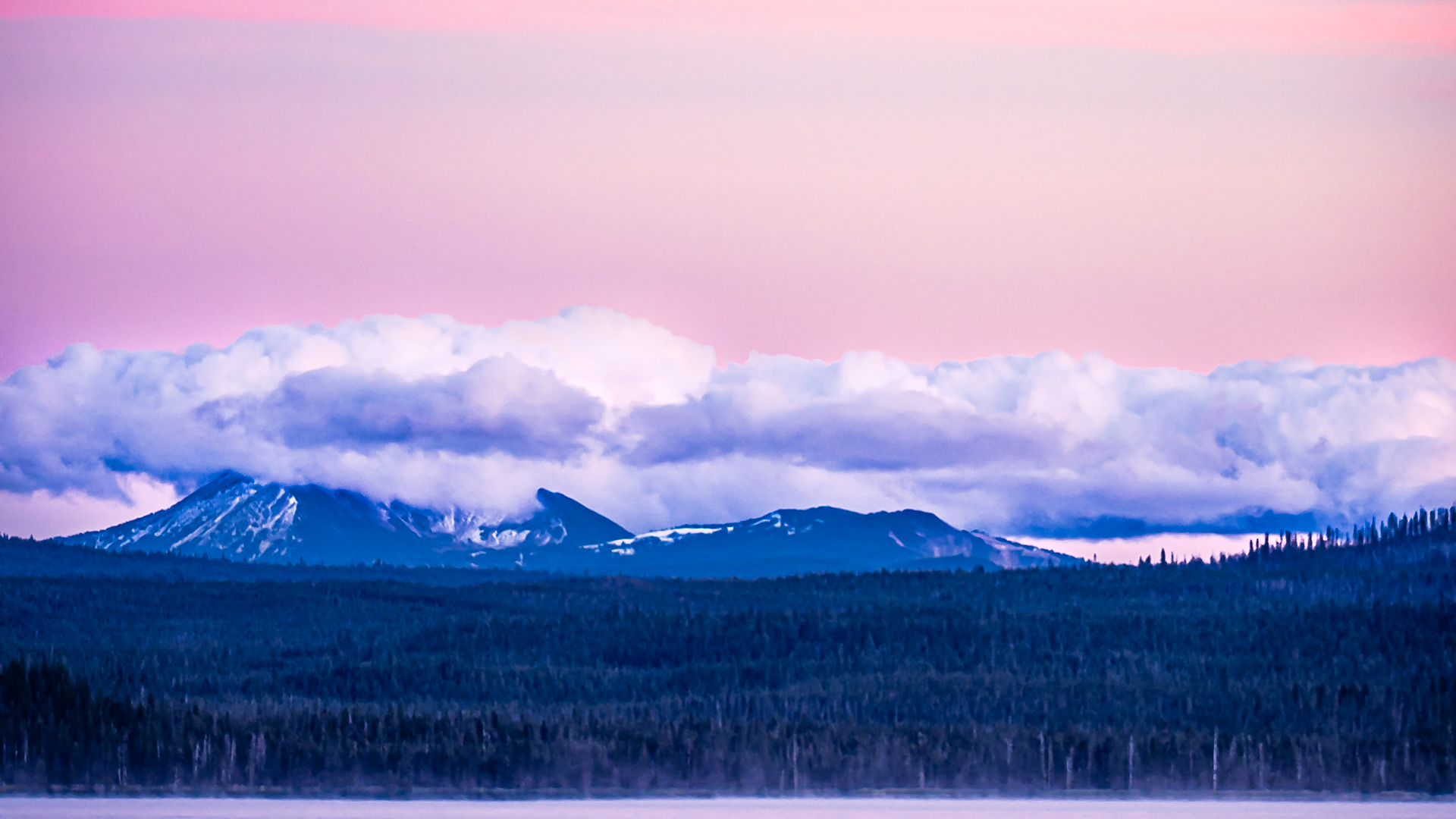 Mt. Mazama After Sunset: Mt. Mazama wears a cloak of clouds following a refreshing day of wind, rain and snow that was greatly needed to drive away forest fire smoke.  A slight mist rises from Diamond Lake in the foreground