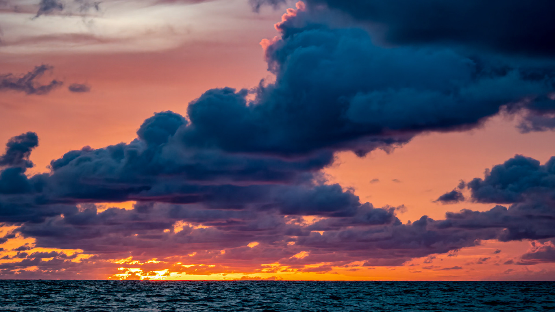South Andros Dawn: Stormy clouds loom as dawn breaks over South Andros Island, Bahamas.