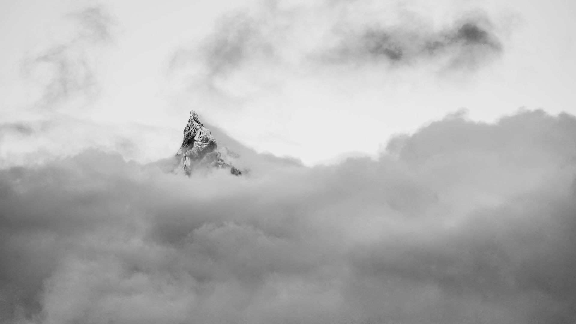 Mt. Thielsen - A Cascade Alp: Mt. Thielsen near Diamnond Lake Oregon peeks through cloud cover showing off its fresh coat of fall snow.