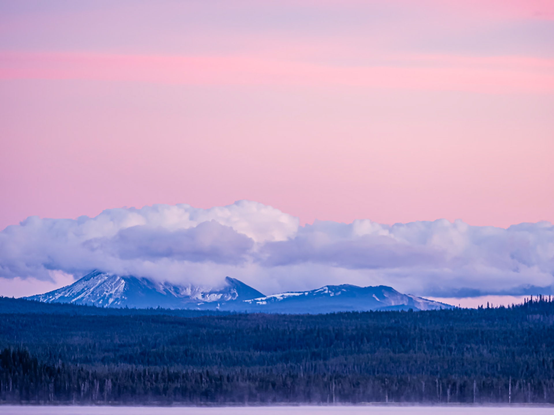 Mt. Mazama After Sunset: Mt. Mazama wears a cloak of clouds following a refreshing day of wind, rain and snow that was greatly needed to drive away forest fire smoke.  A slight mist rises from Diamond Lake in the foreground