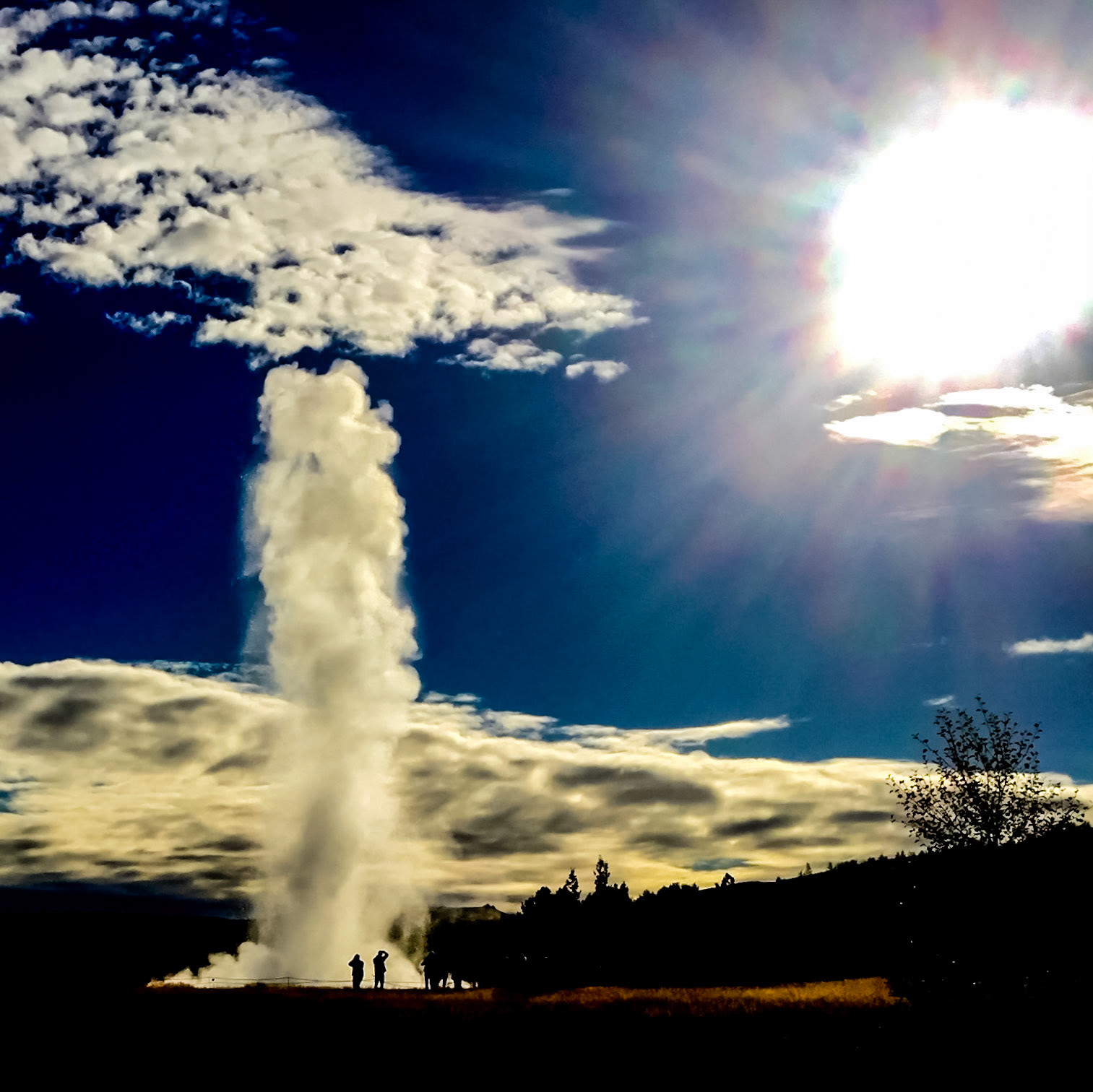 Stokkur Geyser Iceland  - Reaching for Sun: Stokkur Geyser spouts regularly at the Geysir Center on the Golden Circle near Reykjavik Iceland.