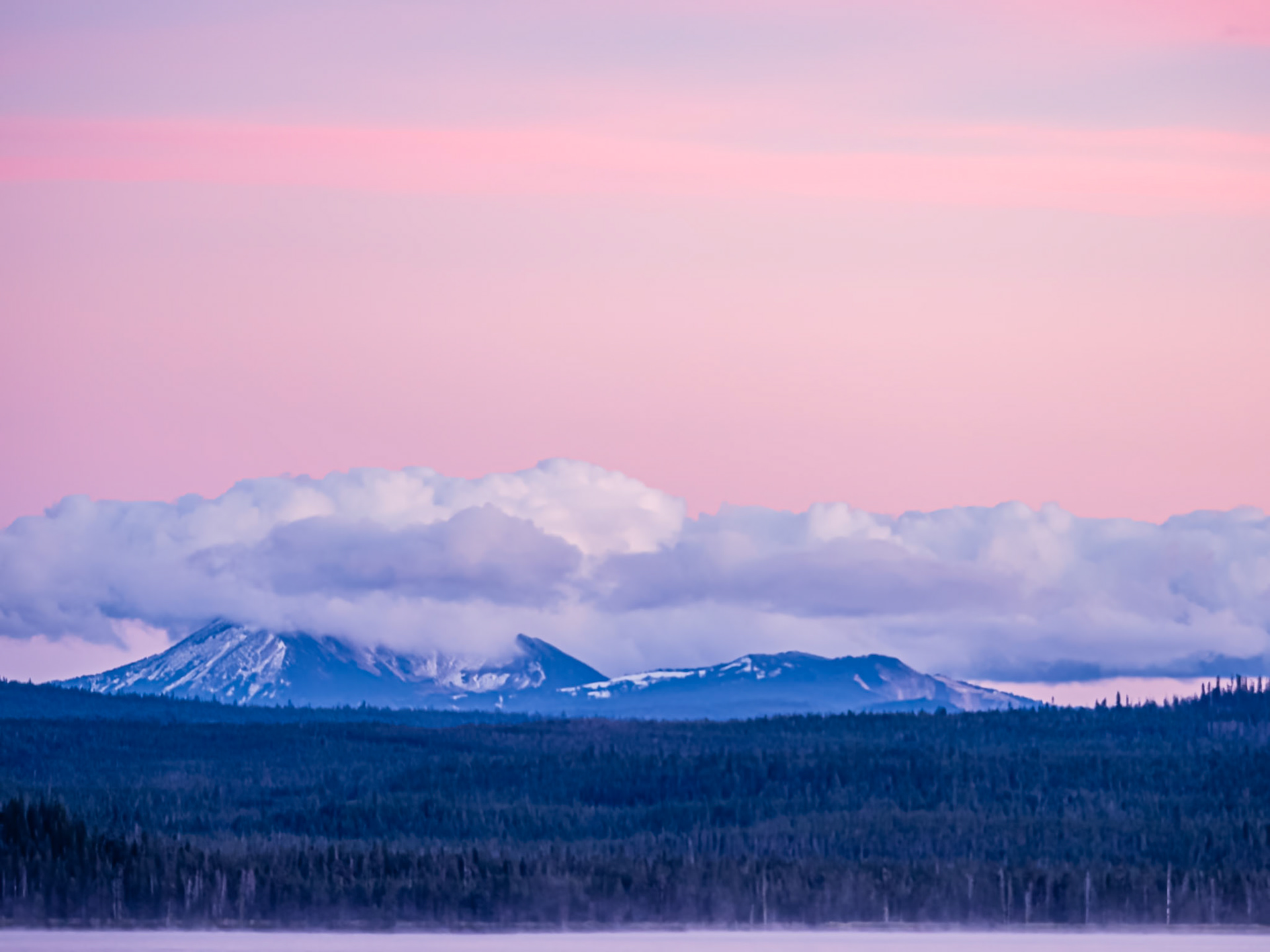 Mt. Mazama After Sunset: Mt. Mazama wears a cloak of clouds following a refreshing day of wind, rain and snow that was greatly needed to drive away forest fire smoke.  A slight mist rises from Diamond Lake in the foreground