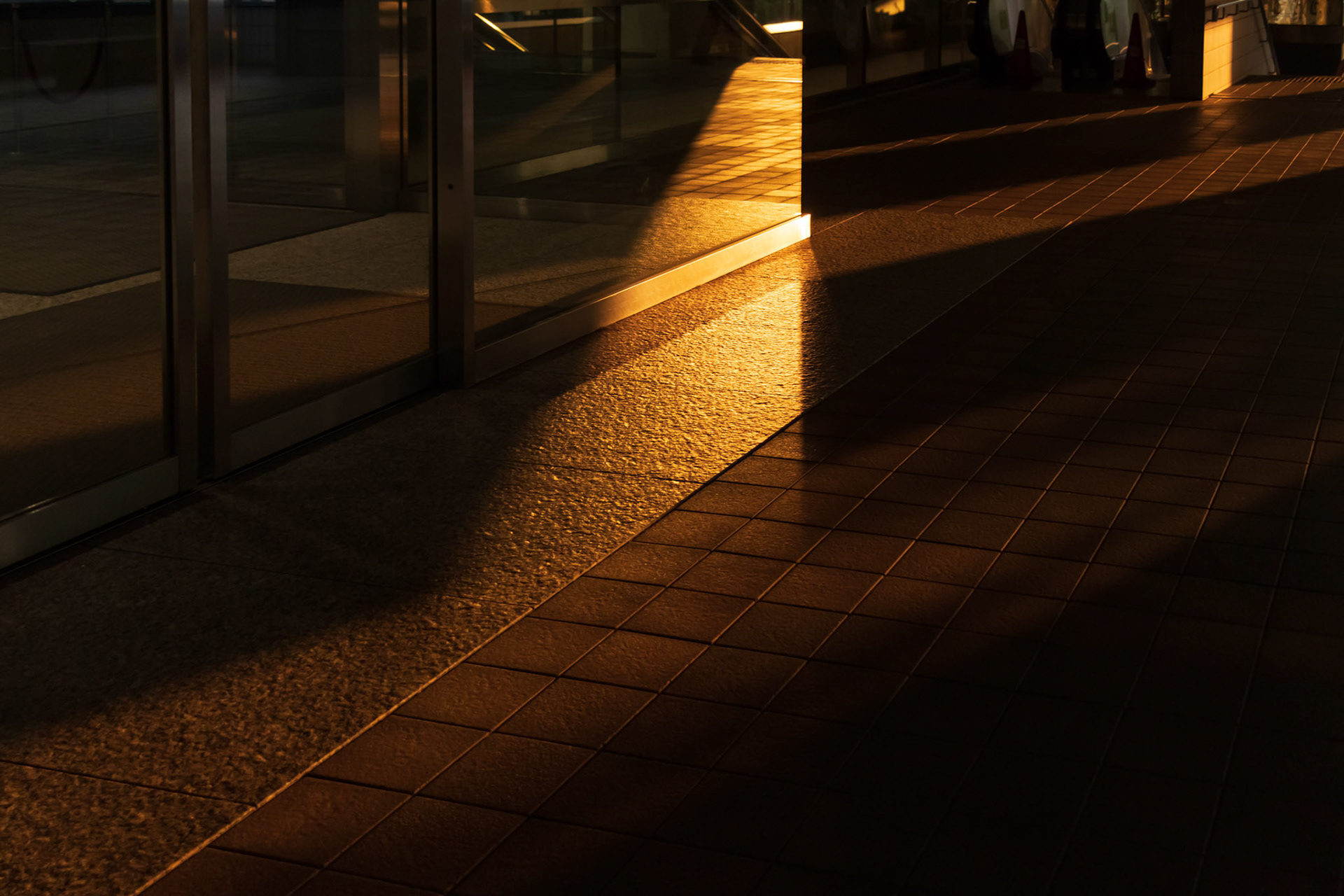 Sunlight on the building floor outside at sunset time. This image was taken in July 2018, Sumida, Tokyo, Japan.