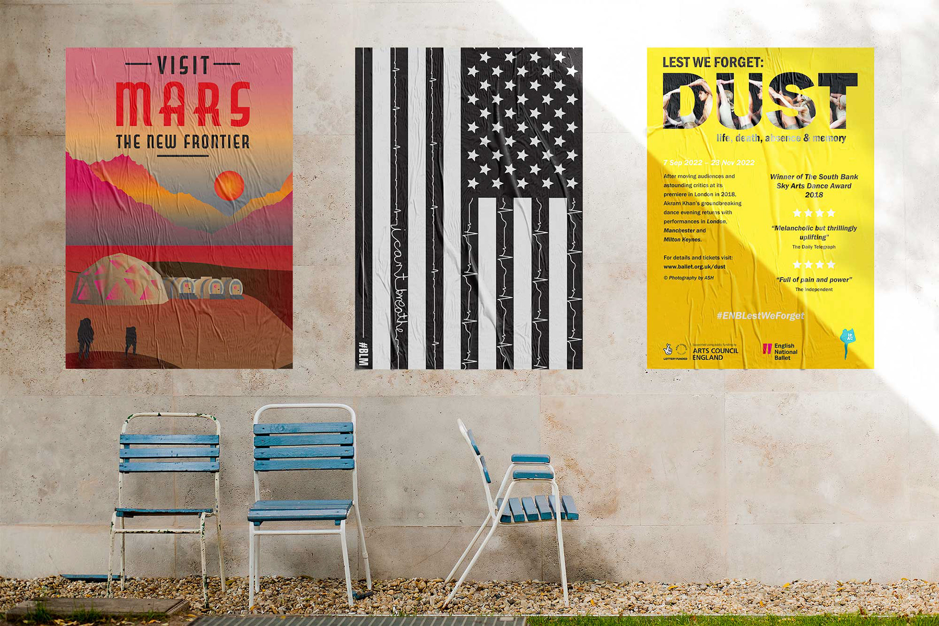 outdoor wall with three posters and three lawn chairs
