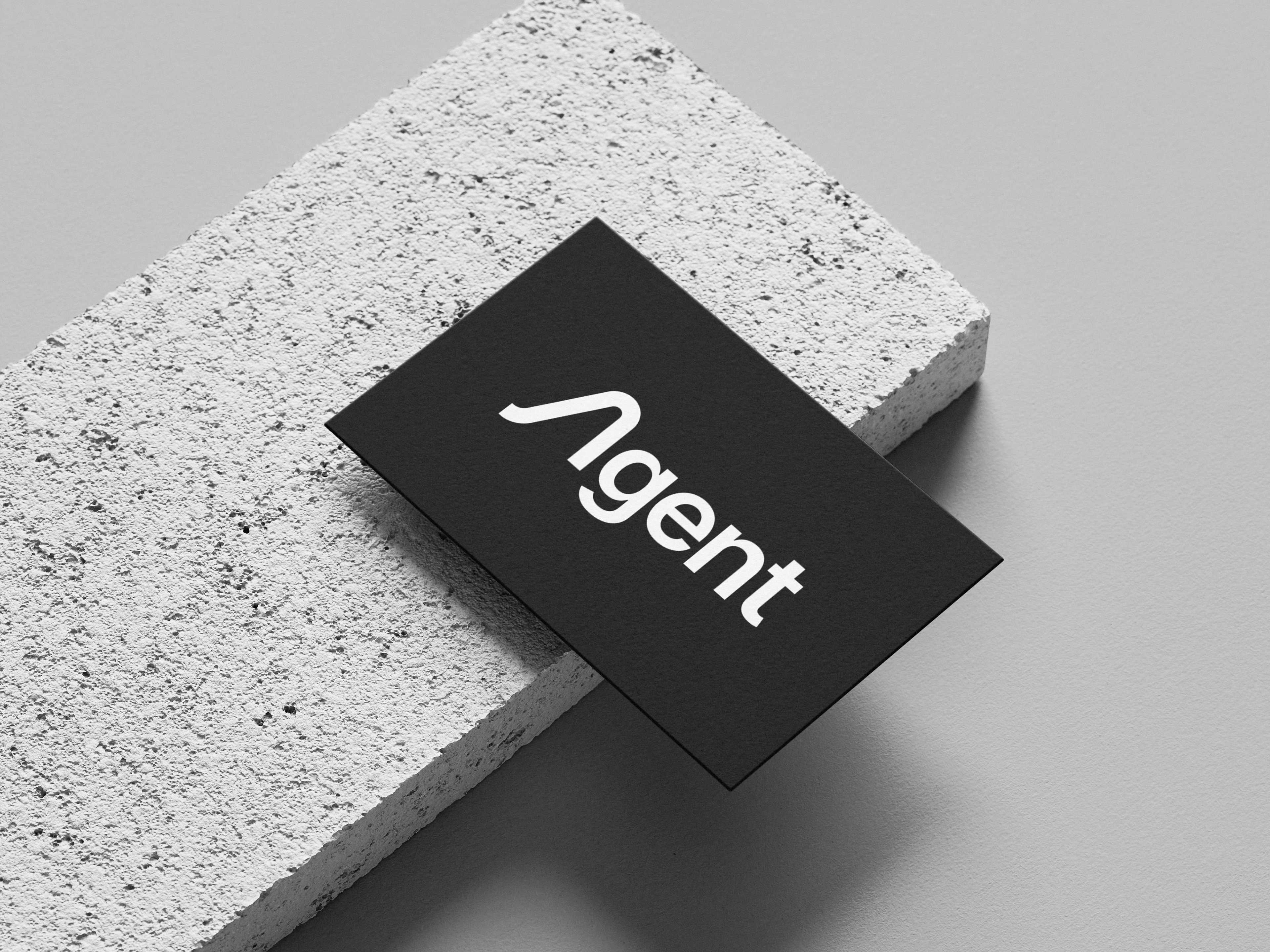 A bold, modern logotype crafted for Agent, a cloud platform built to deploy, manage, and scale AI agents. The custom “A” integrates a stylized lambda (λ) form—evoking both intelligence and computation—while maintaining minimalism and forward momentum. Clean typography balances abstract symbolism with clarity, projecting trust, innovation, and developer-first focus. Designed for scalability across digital and print. Role: Logo Design, Brand Identity Tools: Illustrator, Figma
