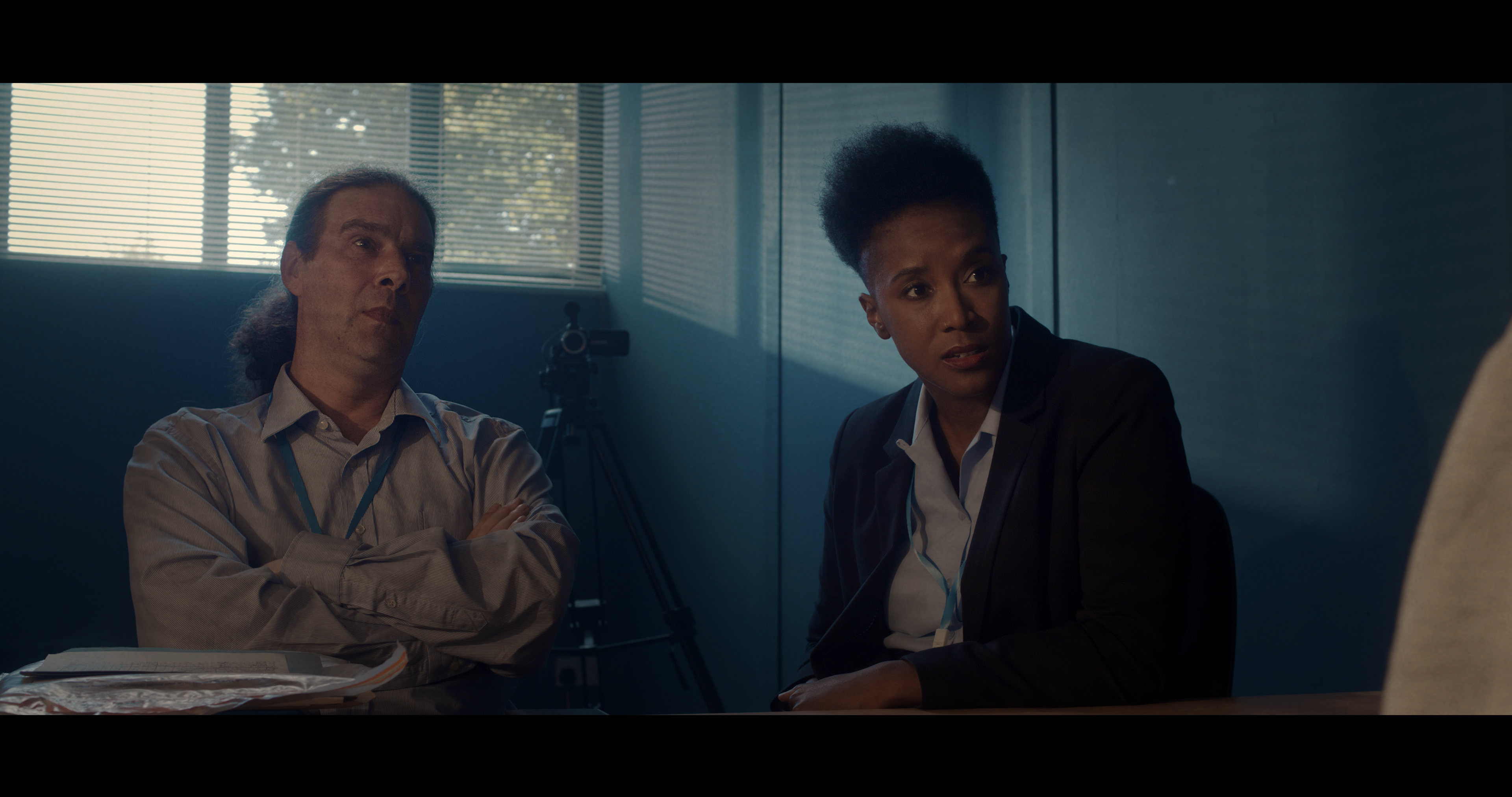 Two detectives interrogate the lead