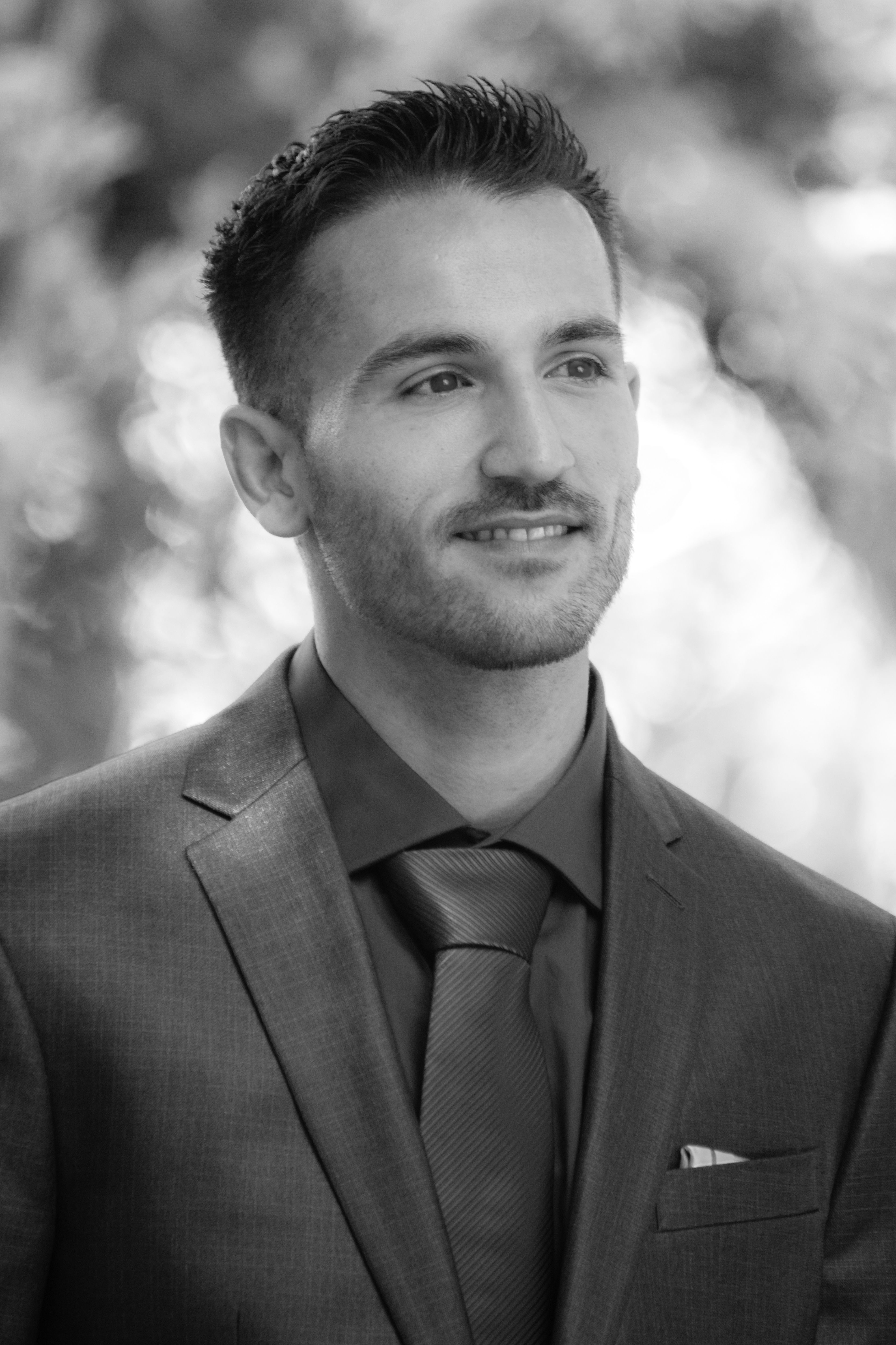 Black and white portrait of the groom