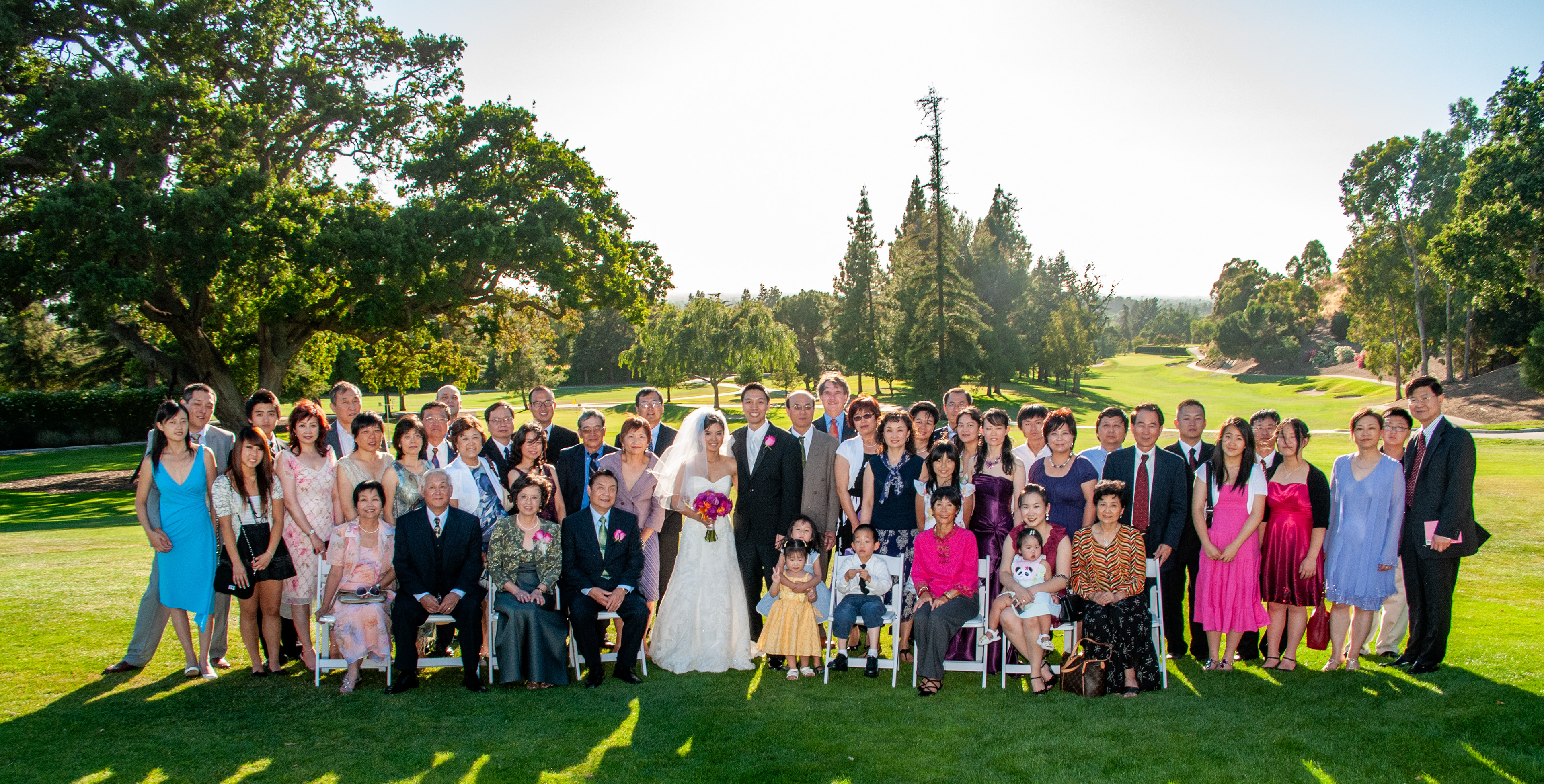 The entire wedding party gathered for a formal portrait on the fairways of San Jose Country Club — a timeless image framed by manicured greens and panoramic backdrops.
