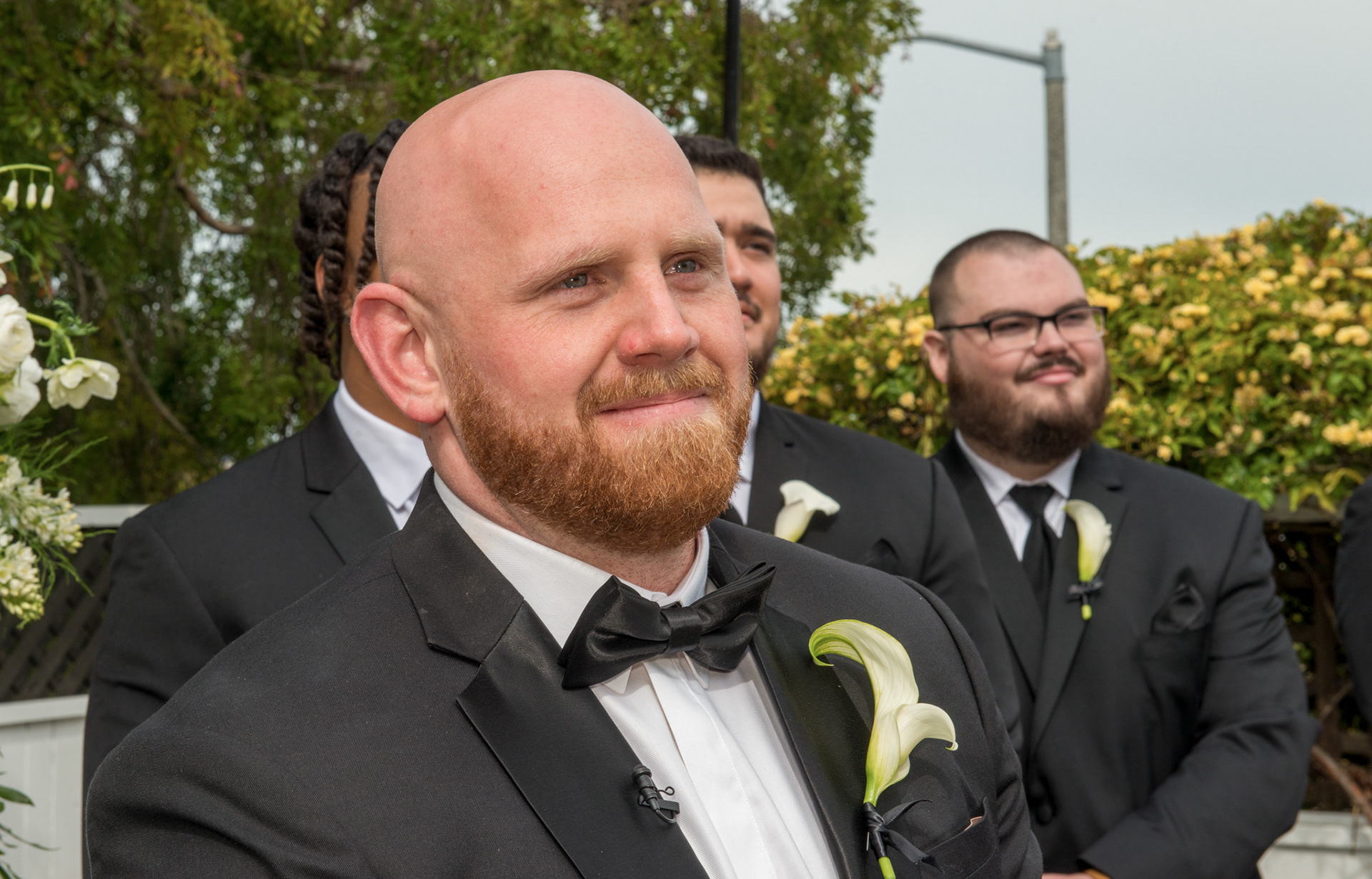 emotional reaction of the groom as bride makes her way