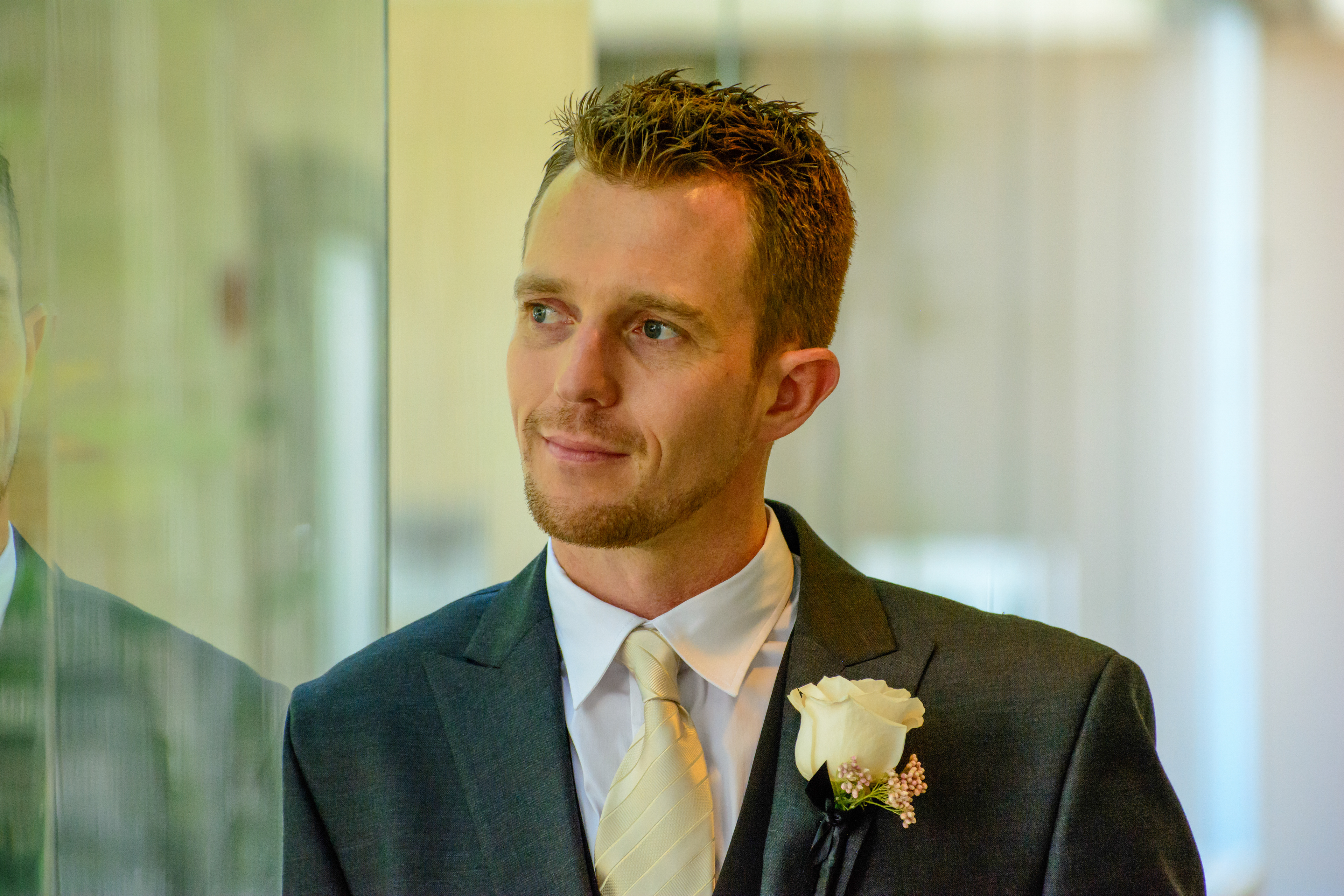 Hotel suite groom prep with groomsmen raising a toast