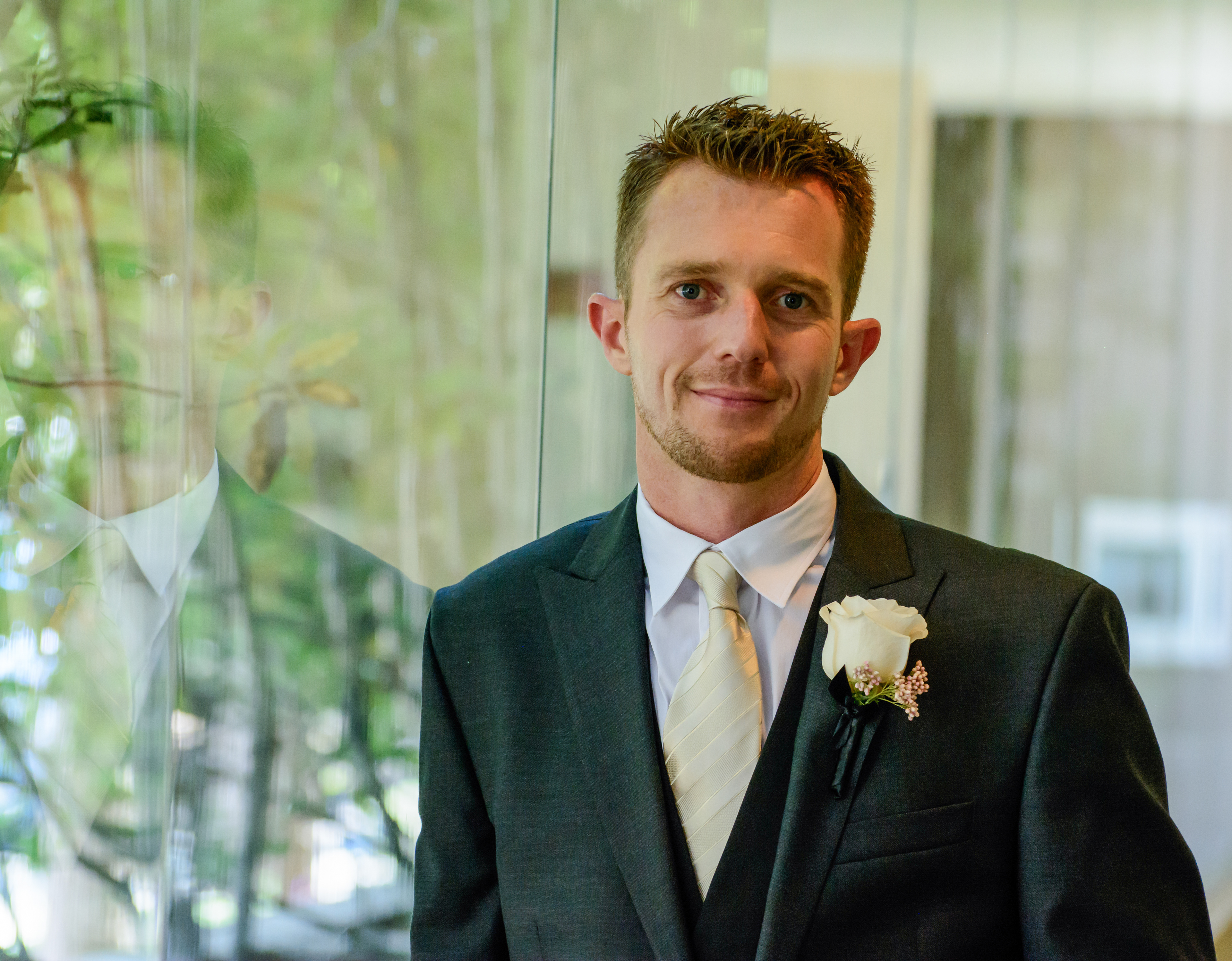 Hotel suite groom prep with groomsmen raising a toast
