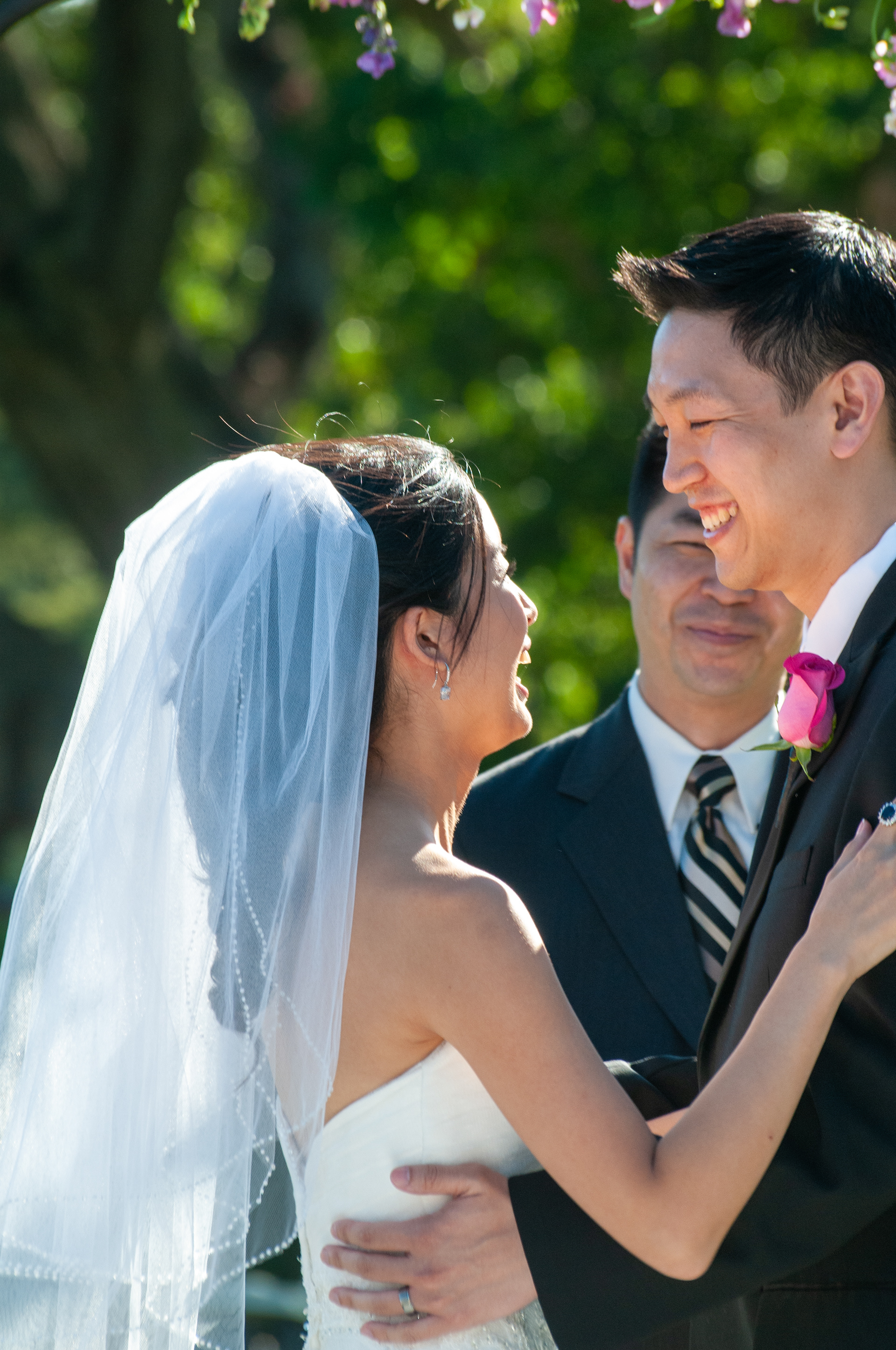 An elegant outdoor wedding ceremony on the greens at San Jose Country Club, with the groom watching as the bride walks down the aisle against sweeping Silicon Valley views.