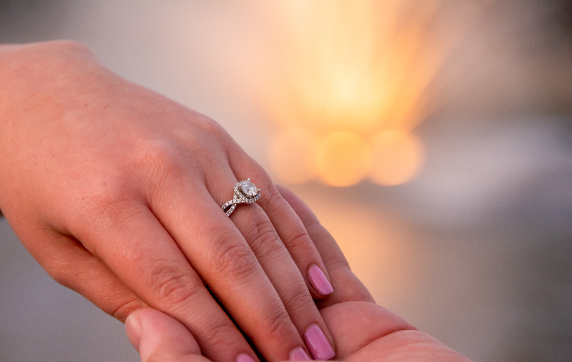 Bride and groom hands with wedding rings Monterey Photography