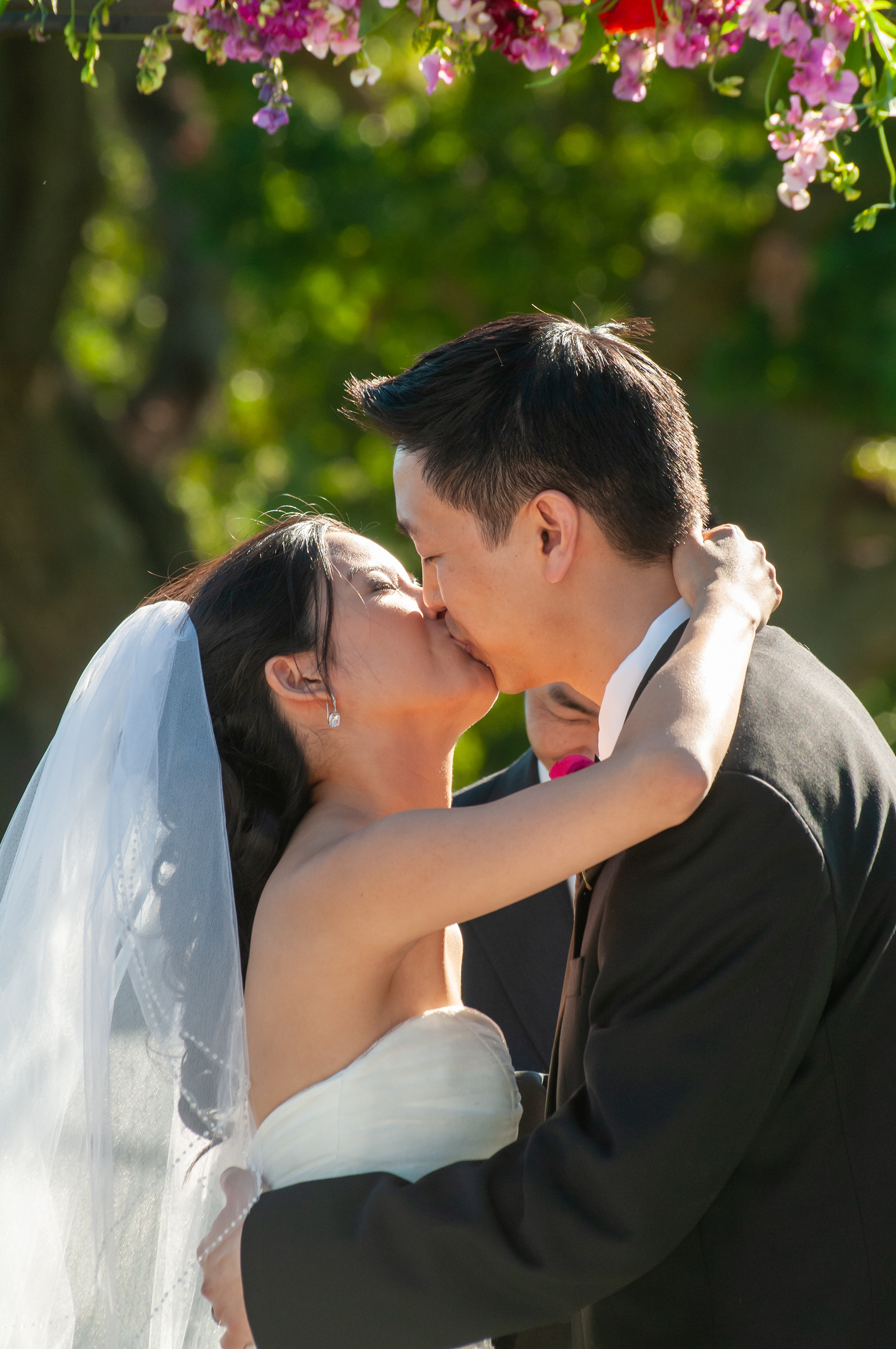 An elegant outdoor wedding ceremony on the greens at San Jose Country Club, with the groom watching as the bride walks down the aisle against sweeping Silicon Valley views.