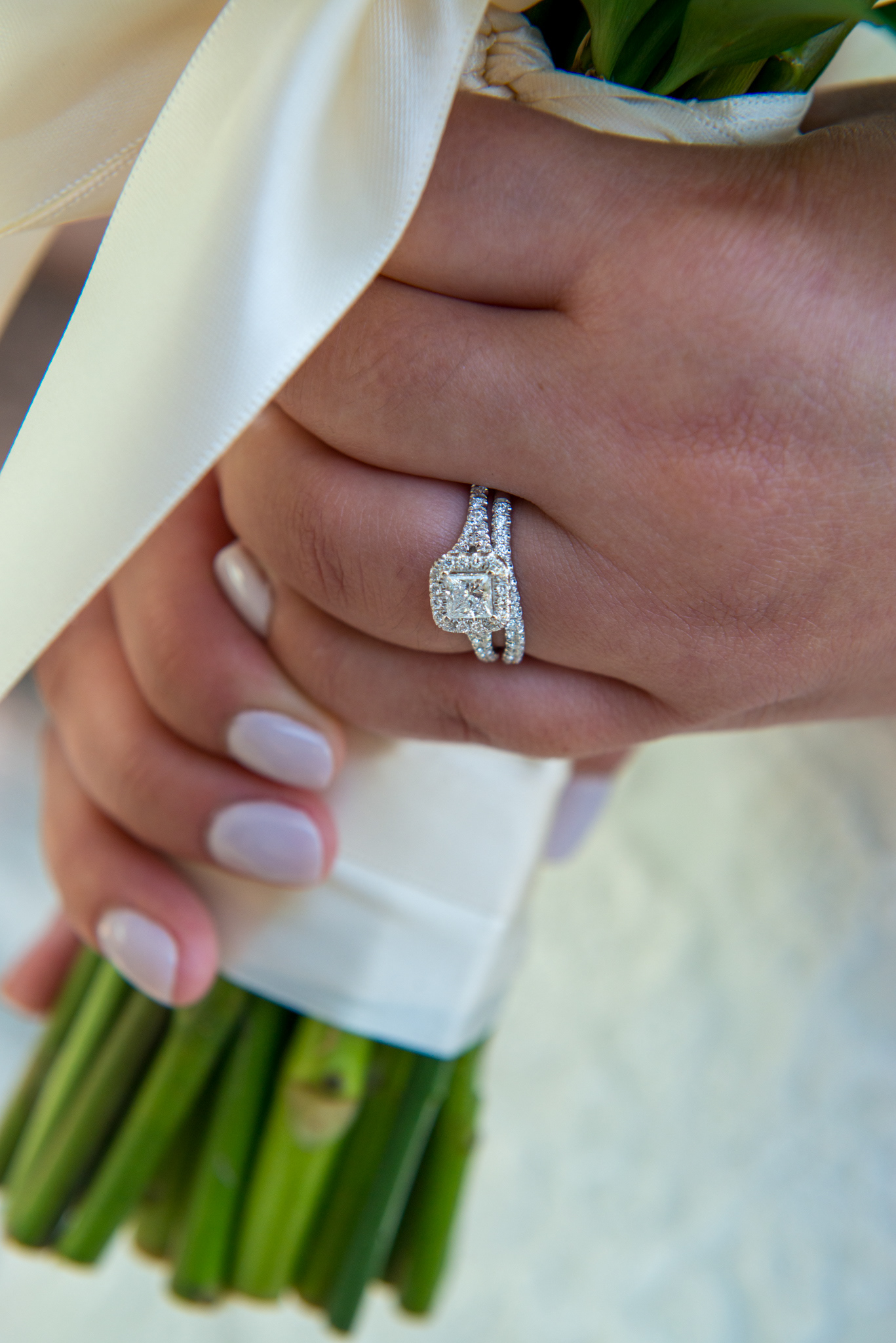 Bride and groom hands with wedding rings Monterey Photography