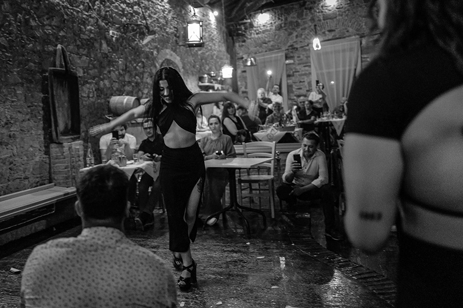  A woman dancing in a classic Greek tavern. Traditionally, plates are broken and men kneel in front of her, keeping rhythm   Chios in Greece ,2023 
