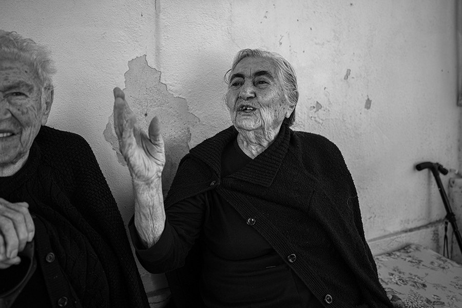 The population of the island of Chios is mostly made up of elderly people. The young population is in the minority. Two elderly women sit in front of their house in the village of Pyrgi.    Chios in Greece,2023
