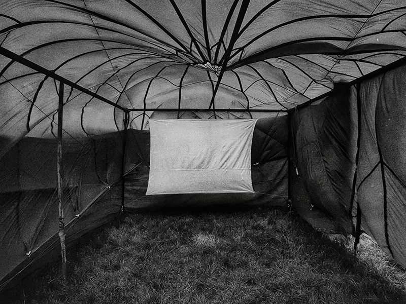 This parachute, used in the Bosnian War, has now been transformed into a tent that protects the screen of an open-air cinema from the sun.