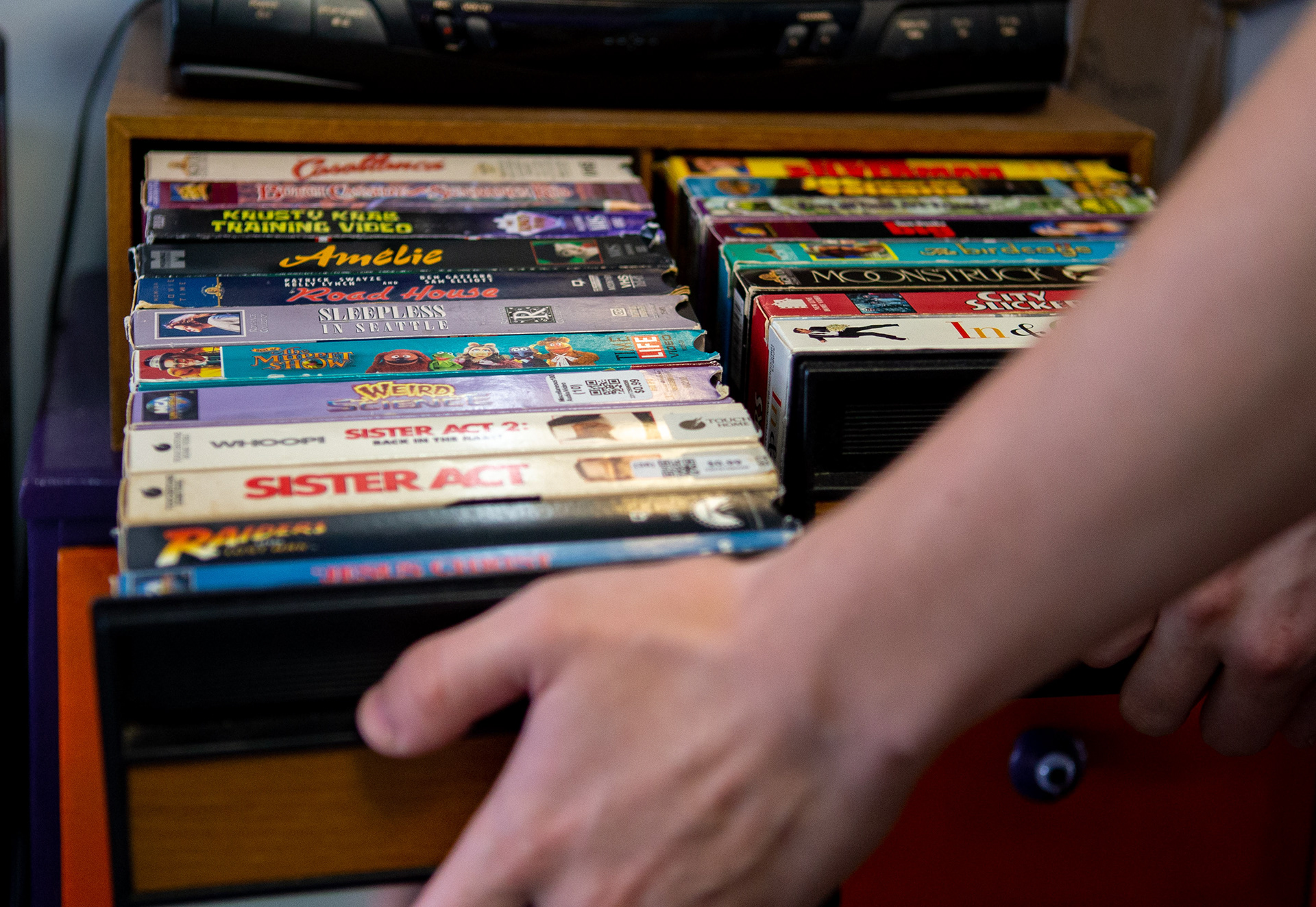 Brandes opens a drawer that shows his collection of VHS tapes. Brandes said “I still enjoy watching them to this day.”