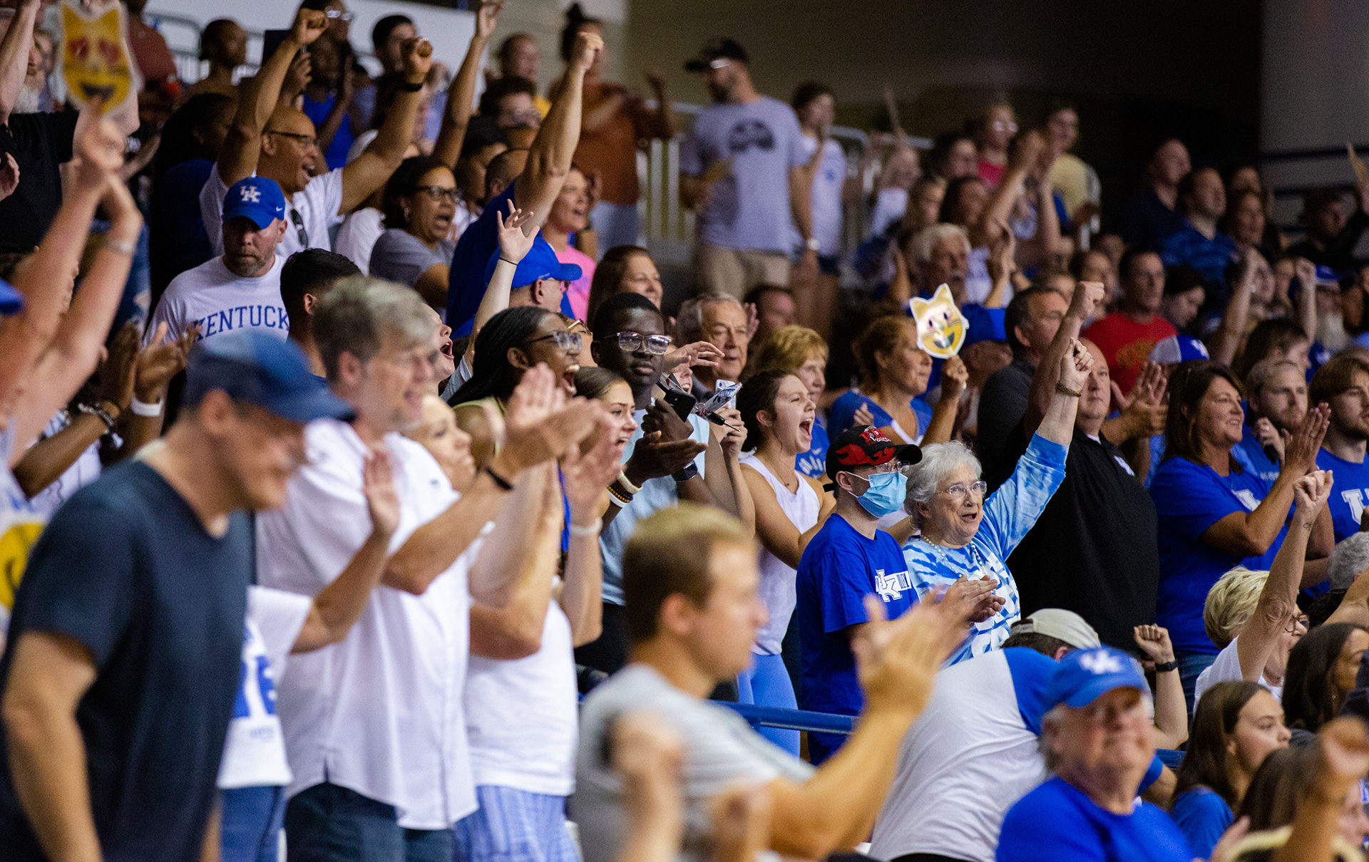 University of Kentucky fans cheer as the UK Wildcats score.