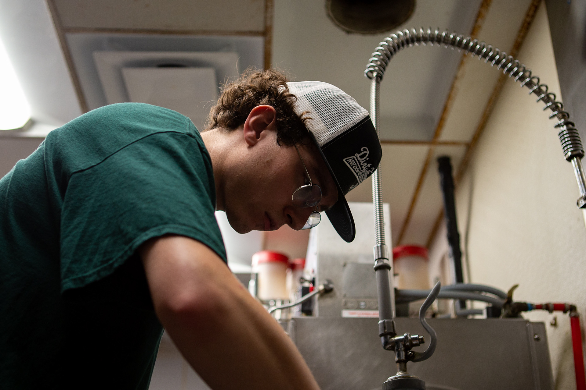 Brandes works dilegently to scrub dishes at Union Street Diner