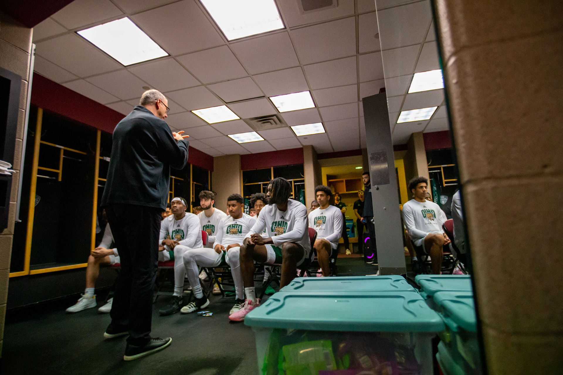 Coach Jeff Boals speaks to his team before the second game in the MAC Tournament held in Cleveland, Ohio,