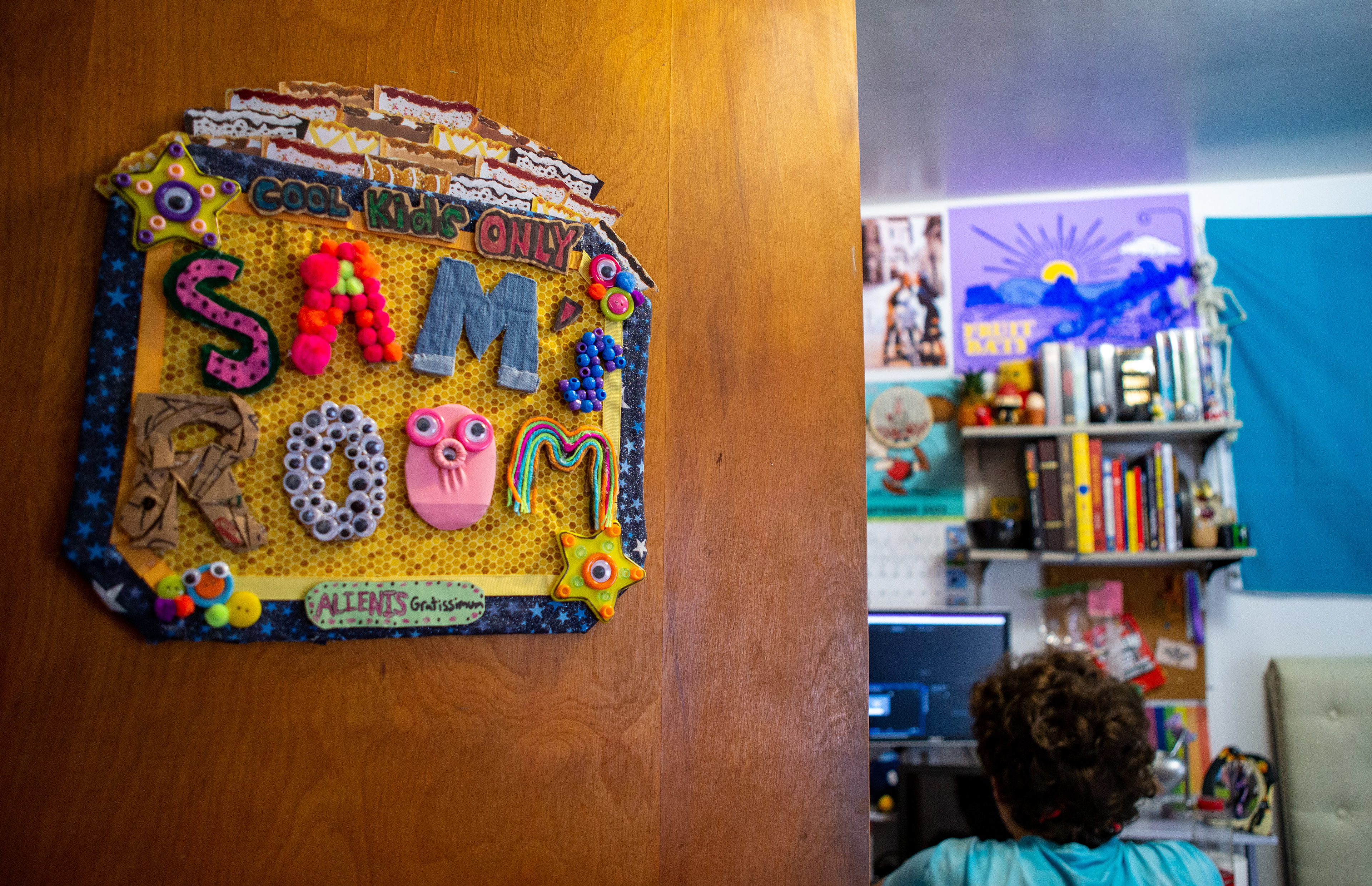A sign outside of Brandes room reads “Cool Kids Only”, accompanyed by various crafting supplies.