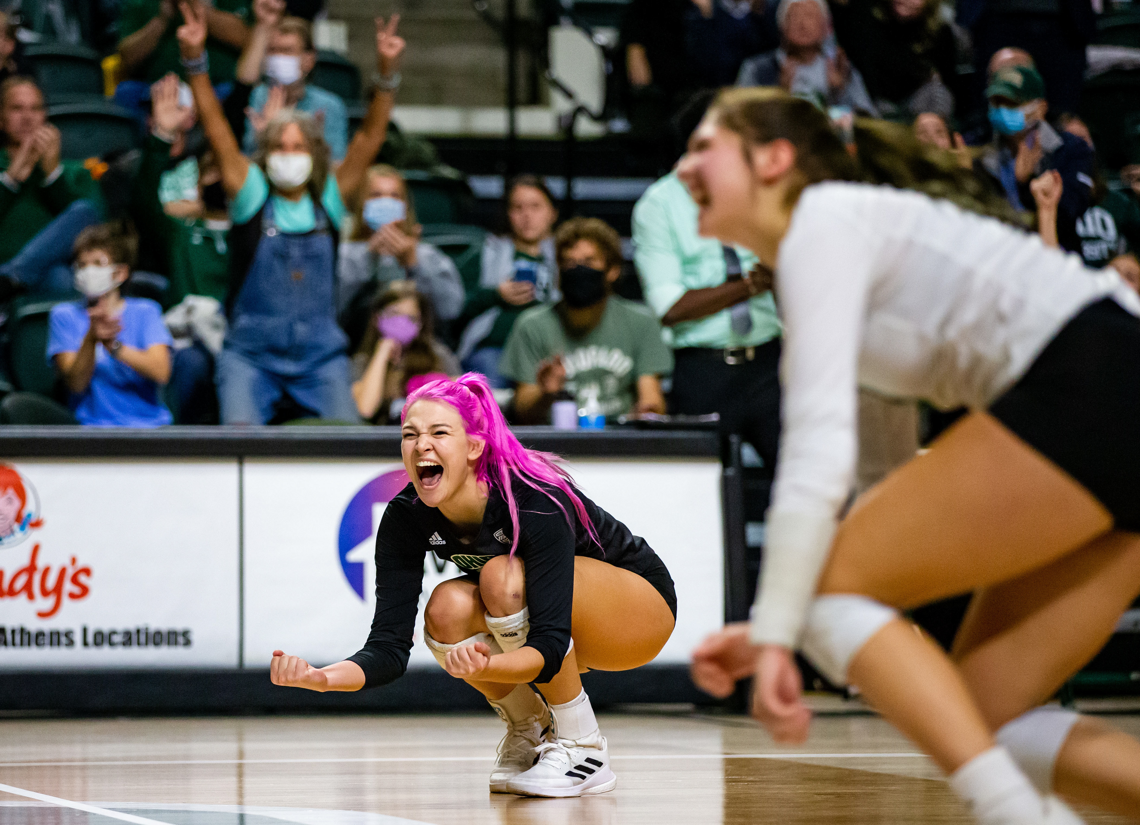 Opposite Hitter Maggie Nedoma cheers after a play during a match.
