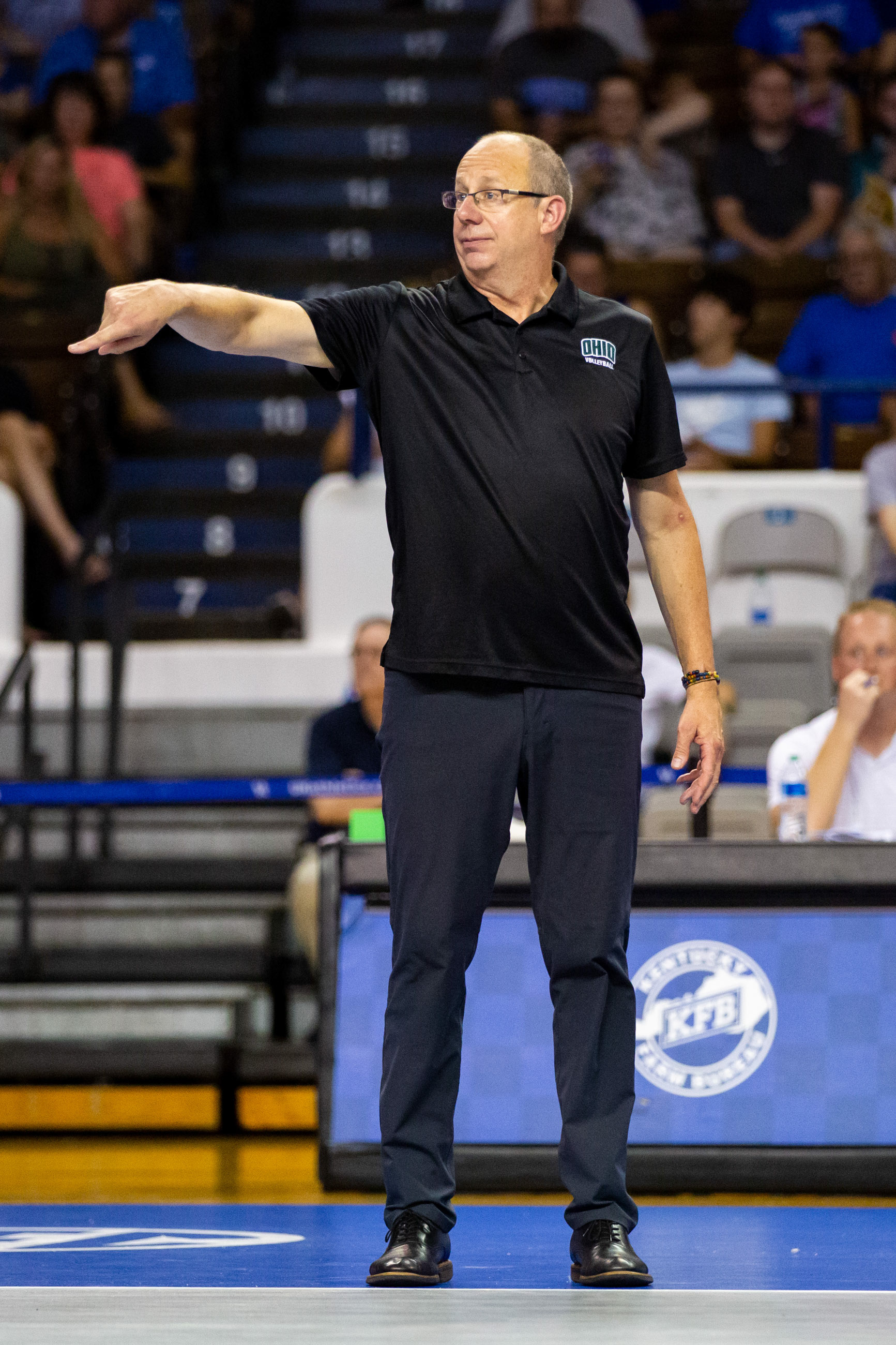 Ohio head coach Geoff Carlson directs his players during the match.