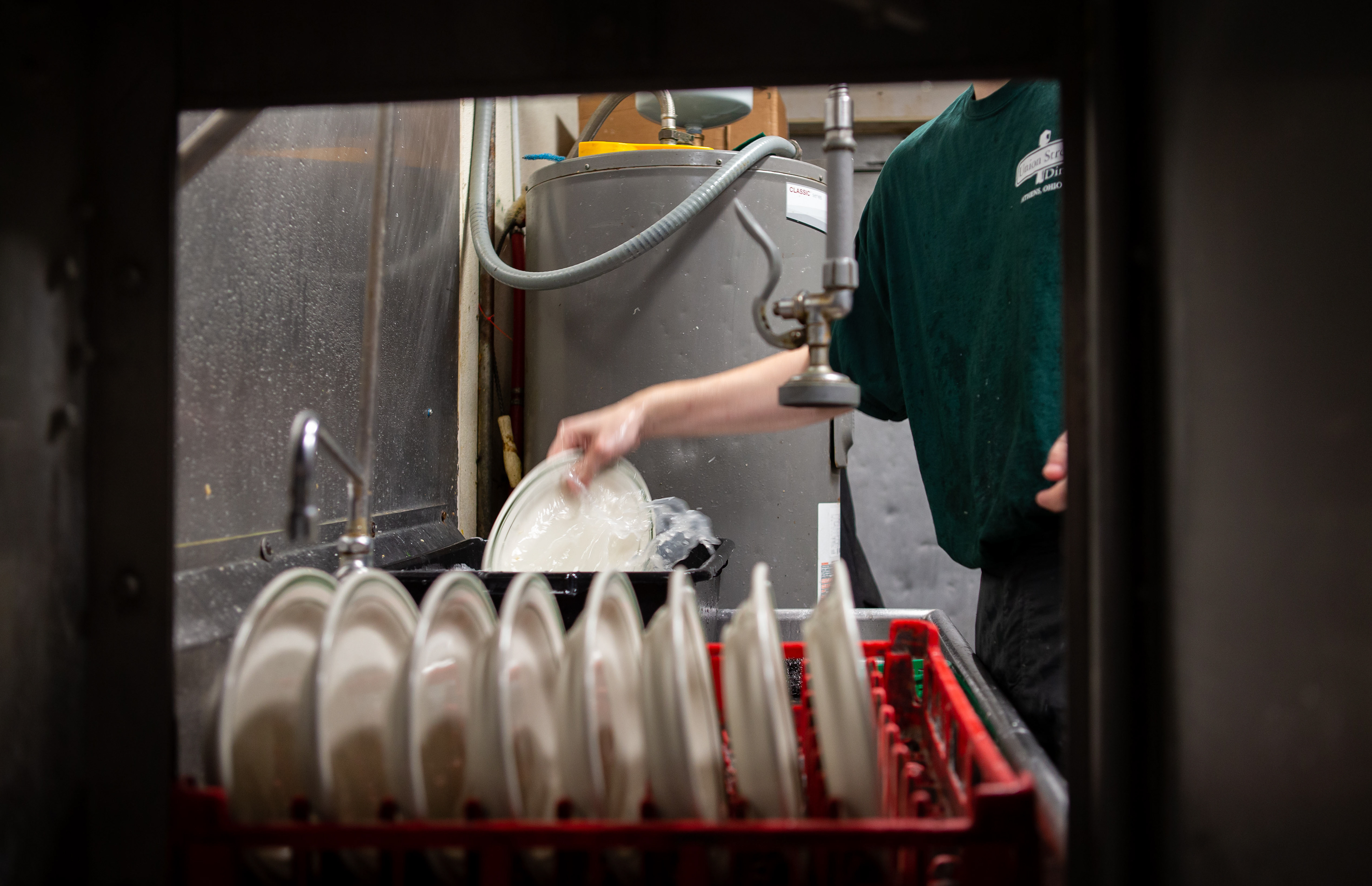 Brandes hand washes dishes at Union Street Diner in Athens, Ohio.