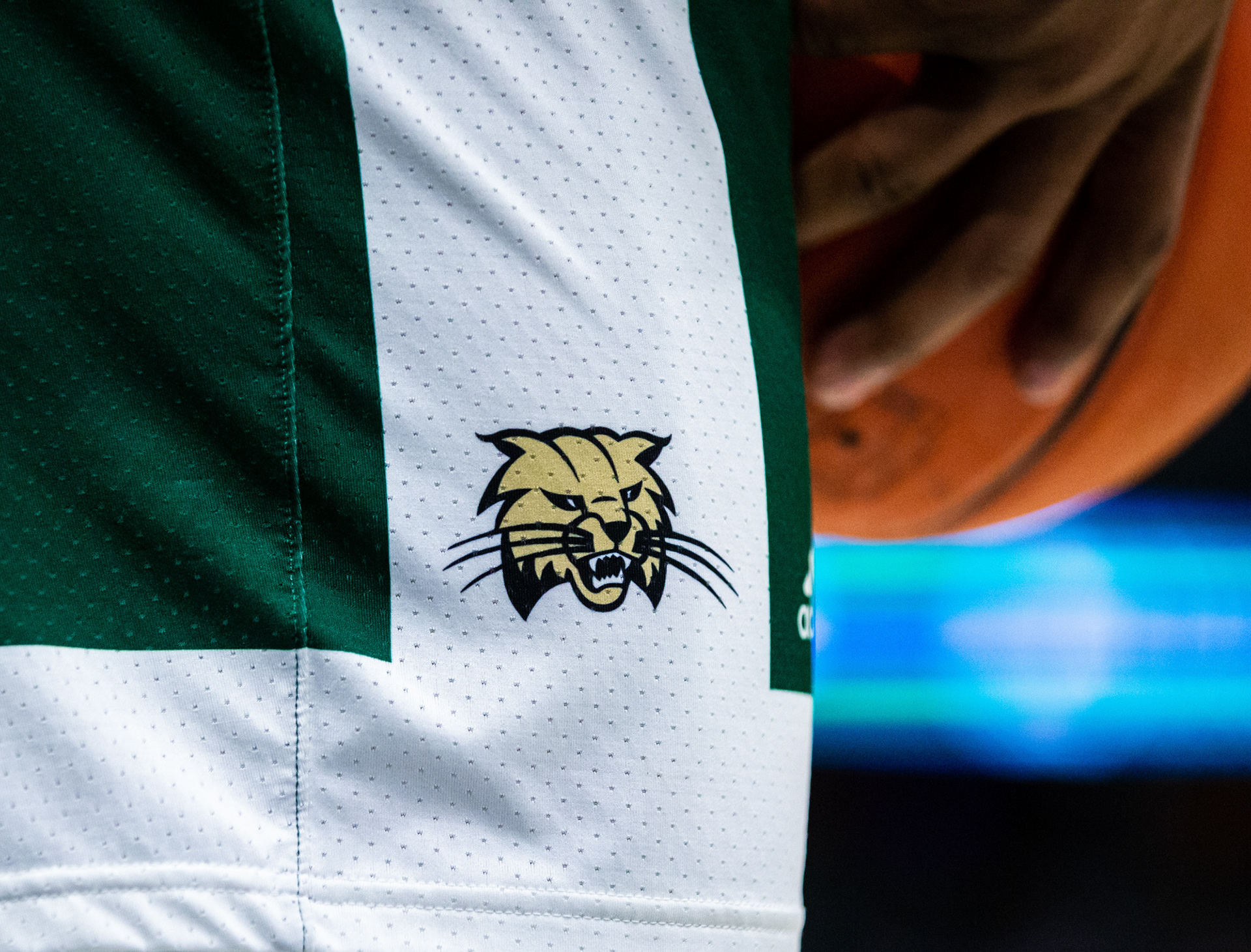 An Ohio Men's Basketball player holds the ball during the MAC Tournament in Cleveland, Ohio.