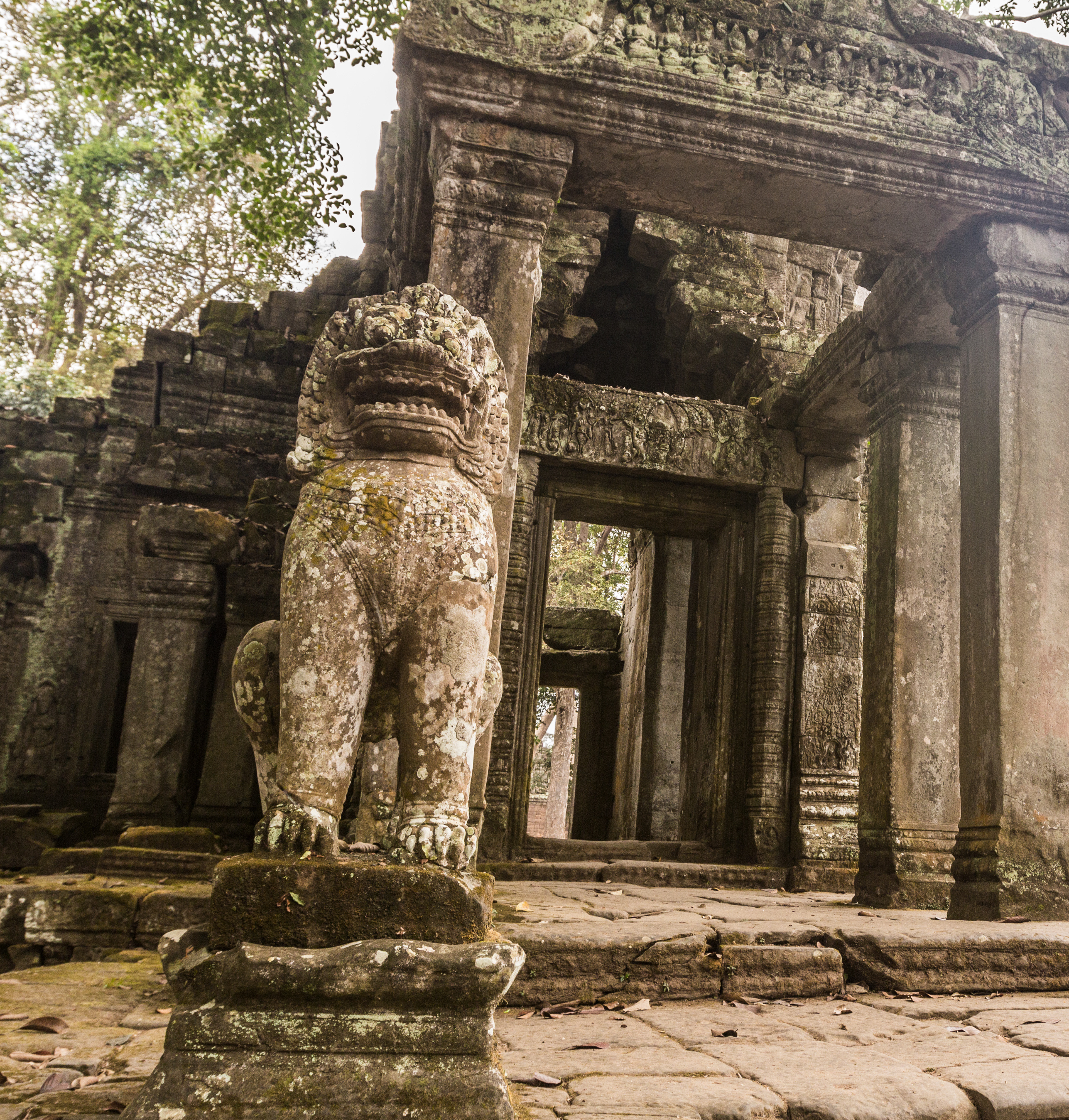 Stone guardians at the jungle entrance to Preah Khan Temple, Angkor Complex, Siem Reap, Cambodia.