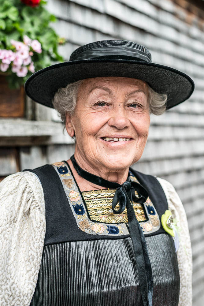 Lady in traditional village dress, Schwarzenberg Village, Bregenzerwald. Even the younger generation are wearing traditional costume as a fashion statement