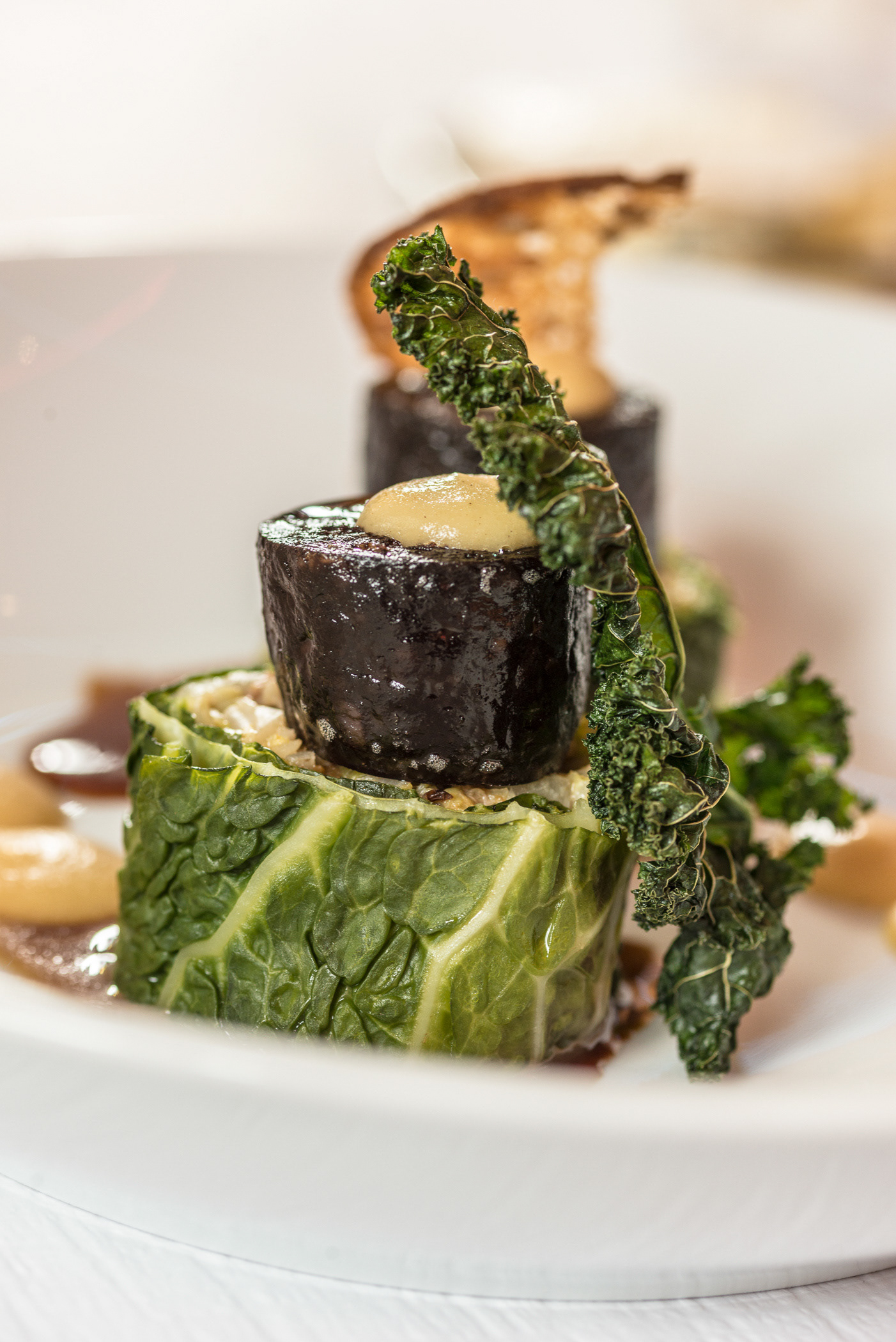 For Cabbage lovers everywhere! Chopped Cabbage and Spek rolled in Cabbage leaf with Venison liver sausage with Kale and Apple vinegar Puree at Restaurant Spitz, Zurich