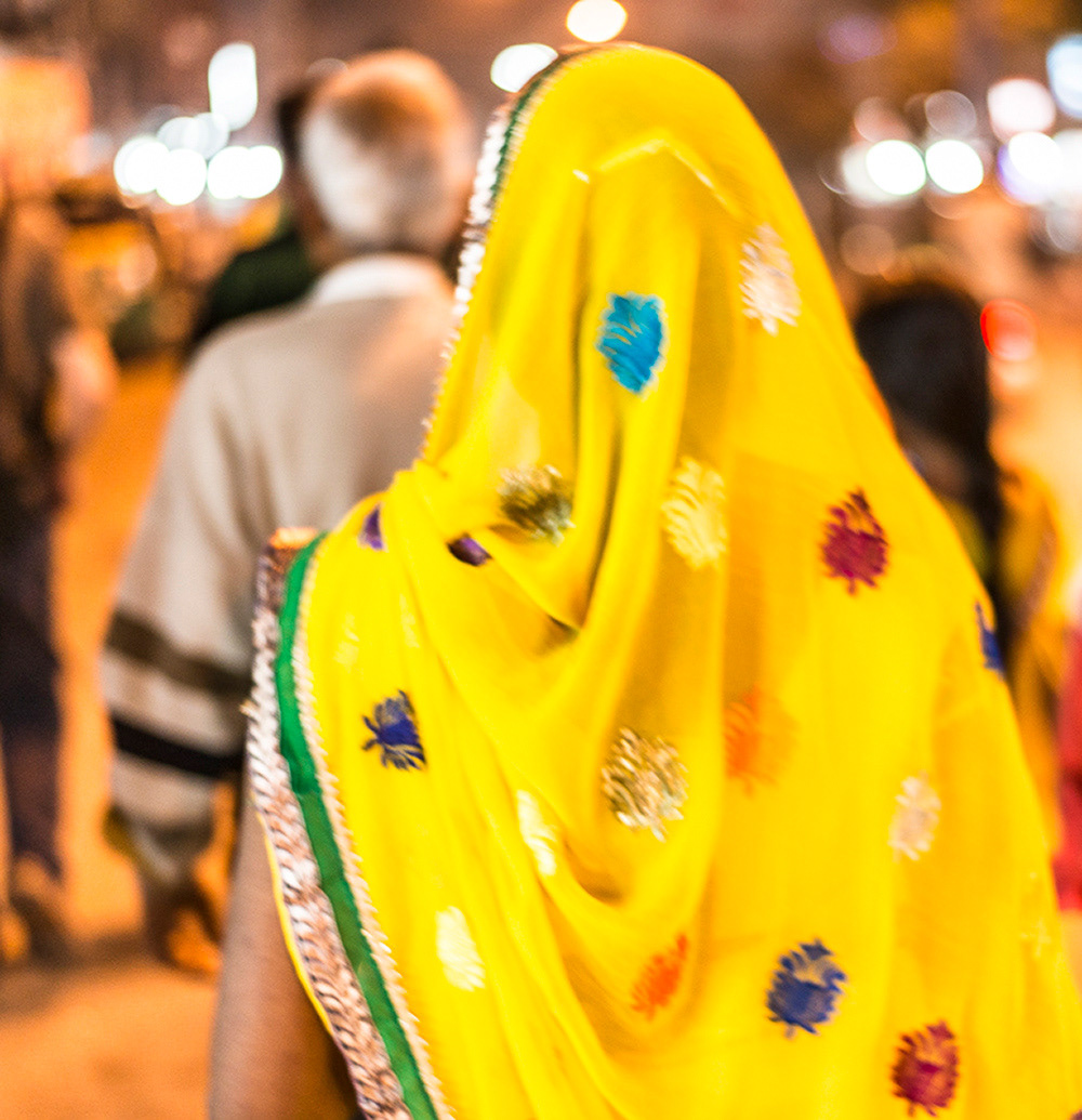 Donning their most colourful saris, women promenade on the streets of downtown Indore on a Friday night