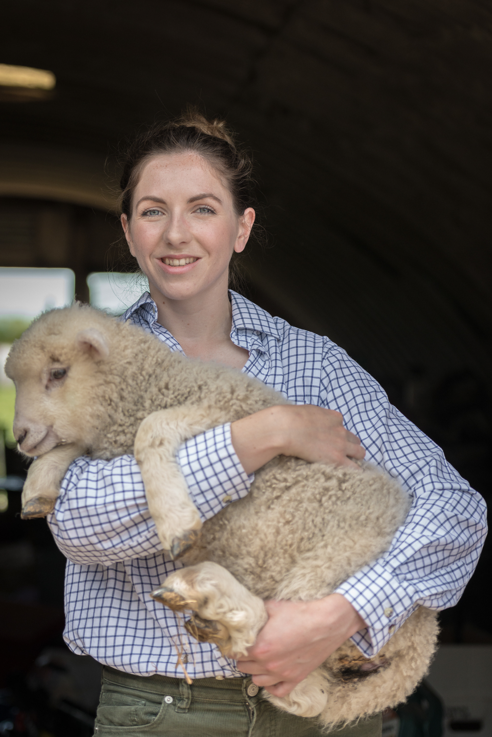 Camilla Hayselden-Adhby with an orphaned lamb at Ashby Farm, Romney Marsh, Kent