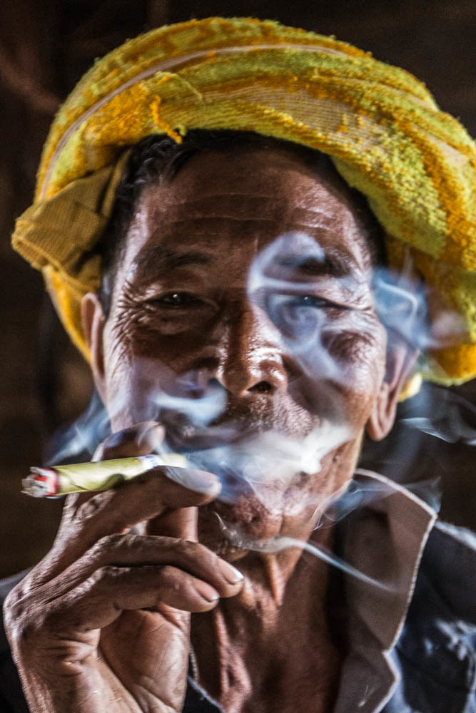 We don't speak the same language but with humour, we reach across the cultural divide. Pein Ne Pin Tribes, where the smoking of cheroots is very much a way of life. Paluang Hill Trib Villiage - Burma.