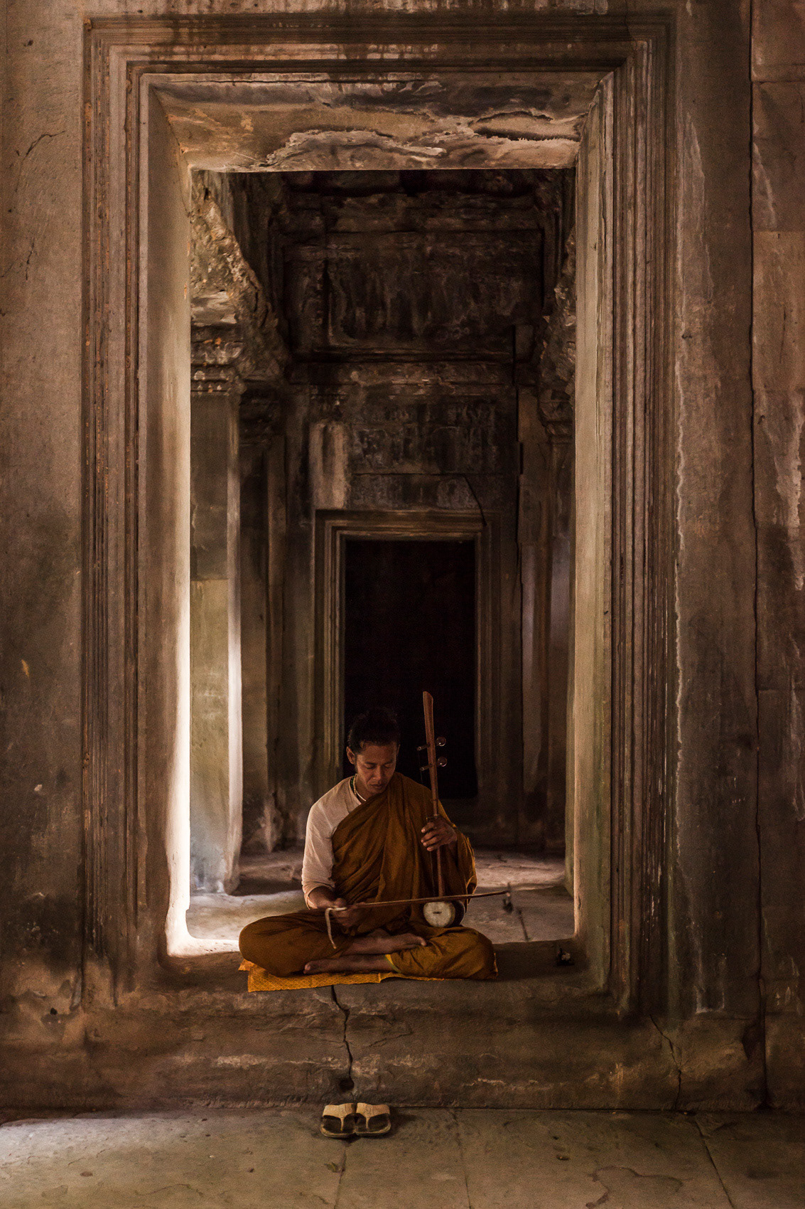 A Buddhist Priest at the south gate of Angkor Wat