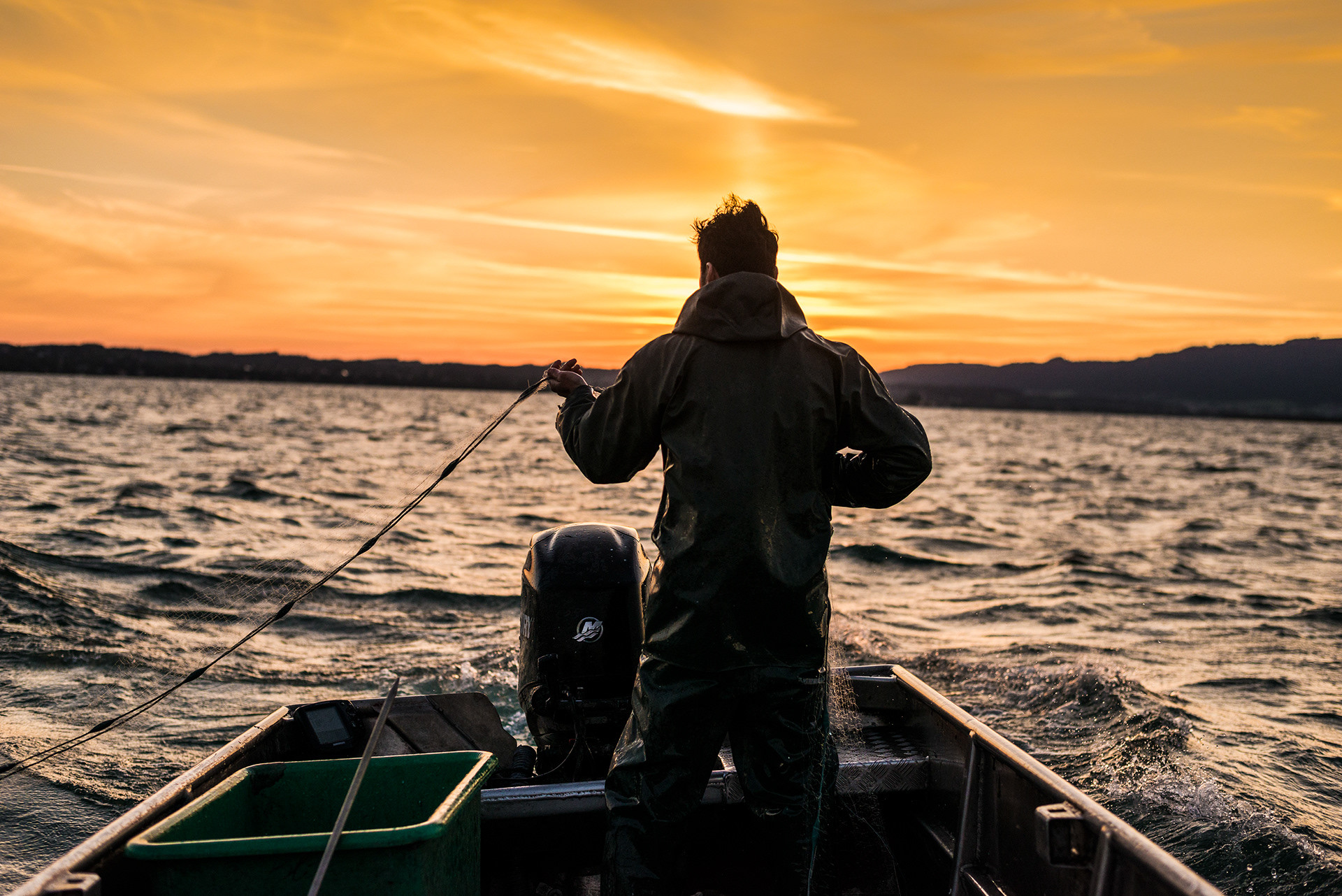 Fishing with Franz Blum in the dawn light on Lake Constance, Bregenz