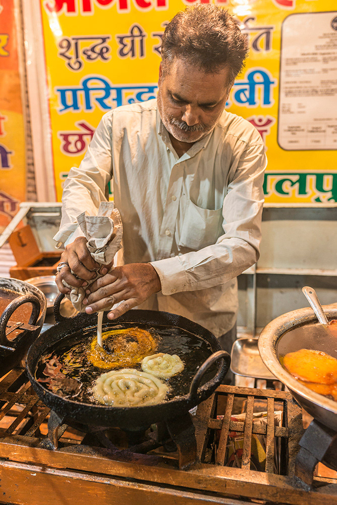 Preparing Jalebi (fried batter dipped in syrup), Sarafa Area, Indore (by day the Sarafa Area of Indore is a jewellery quarter, by night it transforms into a street food bazaar)