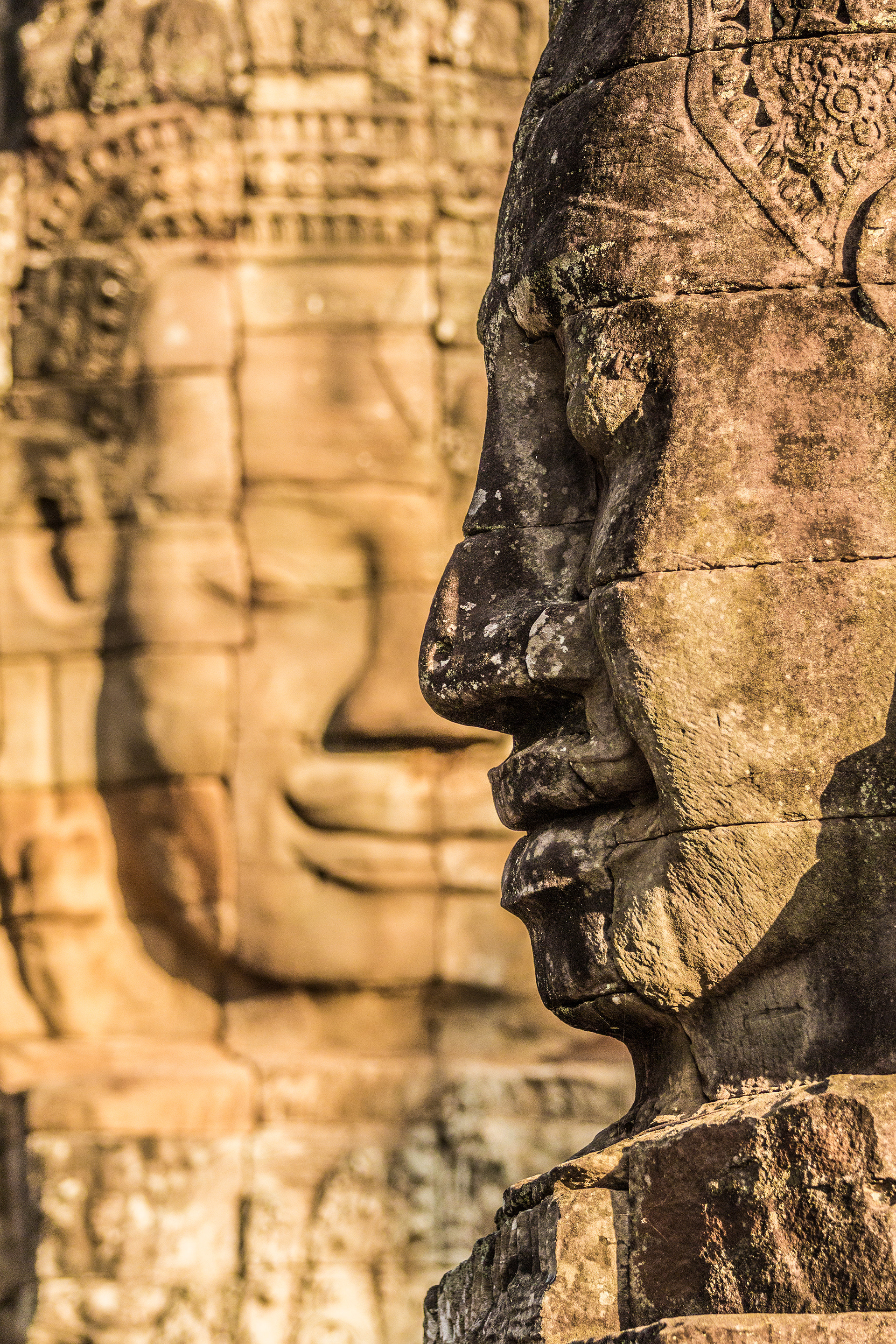 The giant Buddha Faces of Bayon Temple within the Angkor Thom (Anchient City) Complex at Angkor, Cambodia.