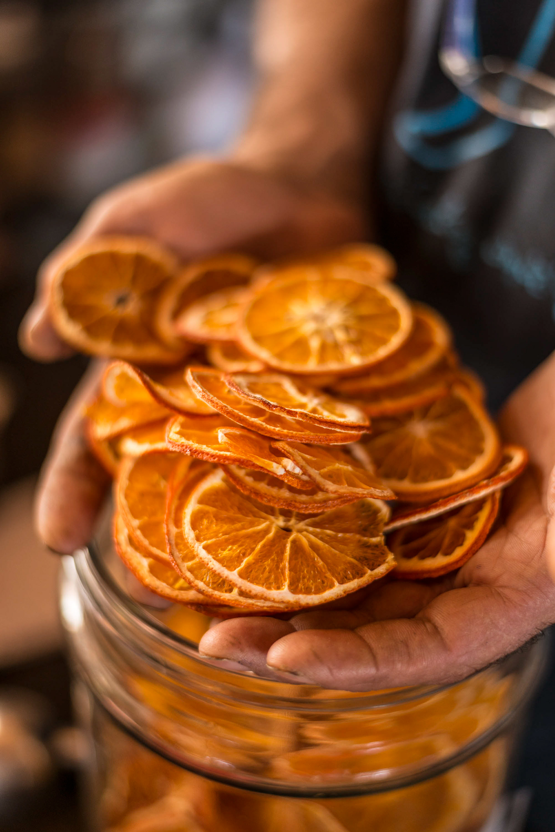 Mr. Giannoutsos owner and Herbalist at Votana Botanicals, with dried oranges, Kouses Village, Crete
