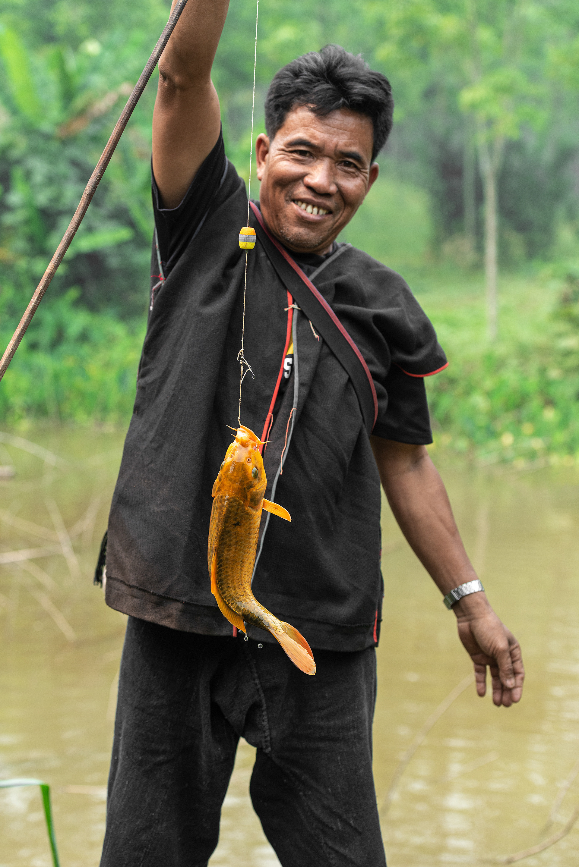 Chermu is the village leader and our homestay host, here he demonstrates the art of carp fishing...