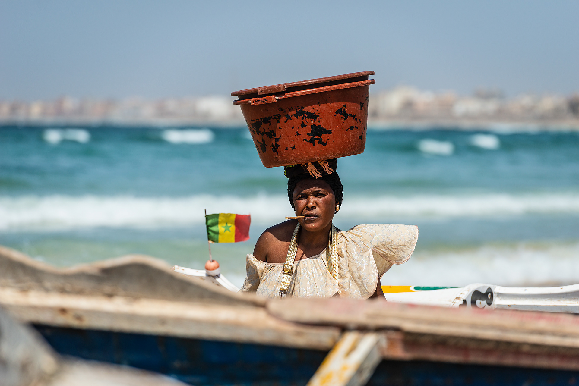 "You looking at me?" Woman awaiting the fishing fleets return at Yoff beach
