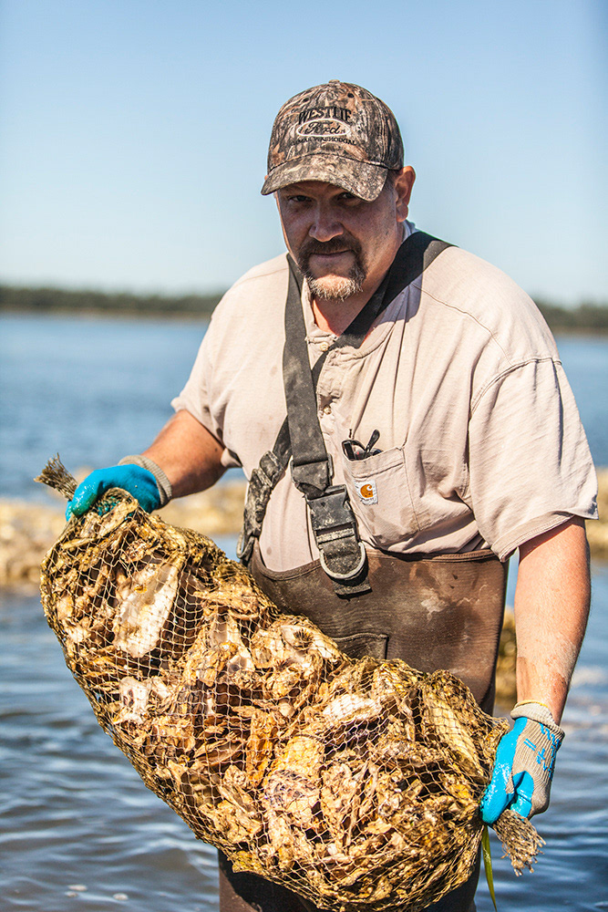 Todd the Oyster farmer, well actually the forester, oysters are just a lucrative side-line. Netarts Bay, Oregon, USA